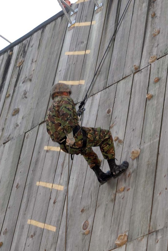 A soldier with the Bermuda Regiment rappels down a tower during a training operation as part of Exercise Bermuda Warrior aboard Marine Corps Base Camp Lejeune, May 4. Approximately 180 Bermuda Regiment soldiers conducted a two-week training exercise aboard the base in a multitude of operation areas, part of their annual abroad training.