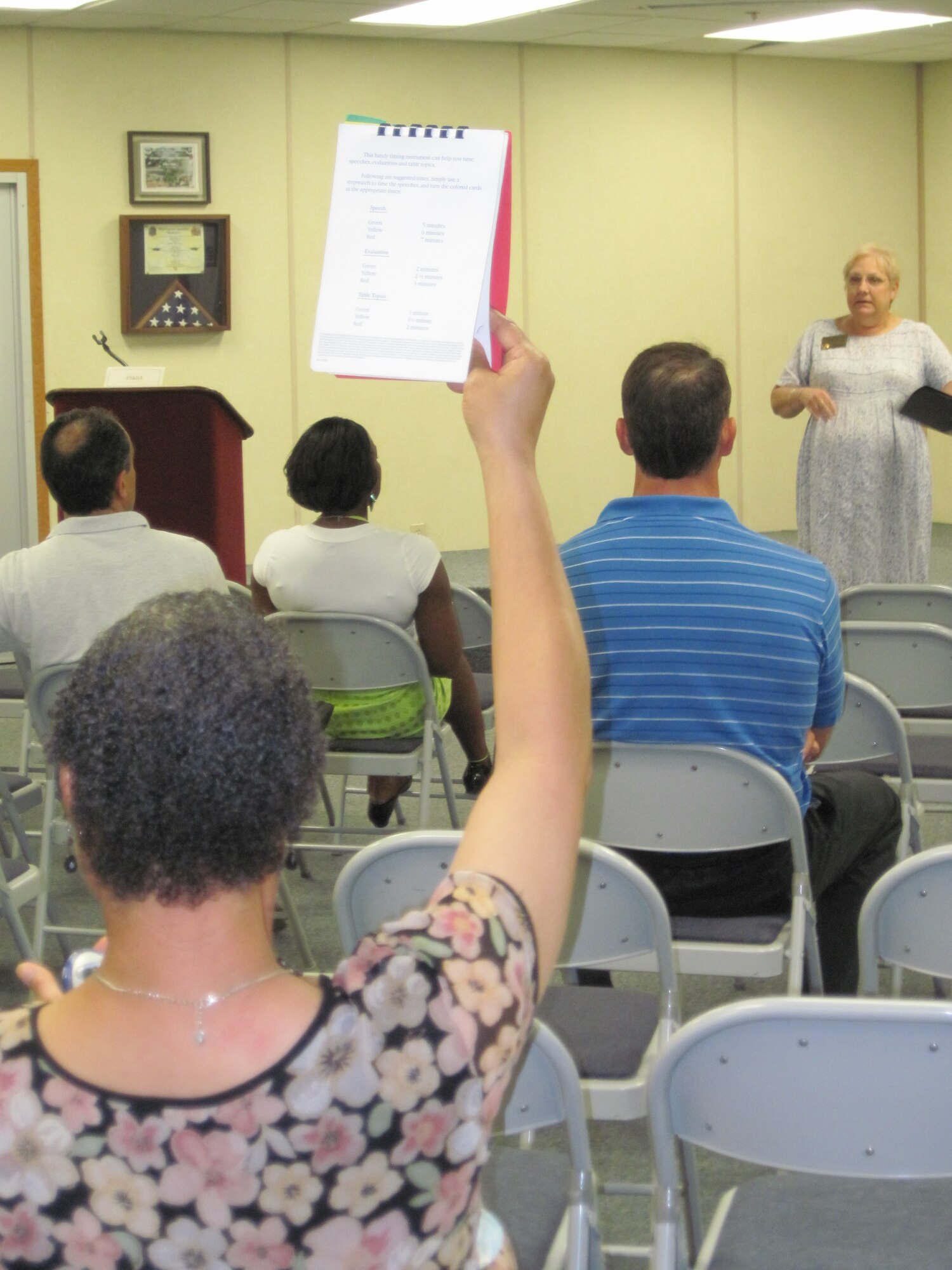 Eglin Toastmaster timekeeper gives speaker warning during open house event May 12. (Photo by Minty Knighton)
