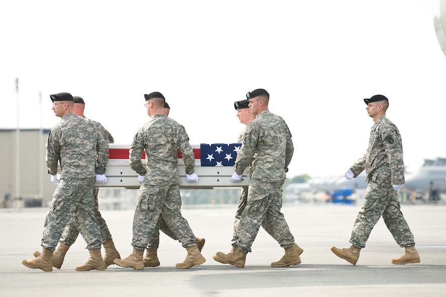 A U.S. Army carry team transfers the remains of Army 1st Lt. Demetrius M. Frison, of Lancaster, Pa., at Dover Air Force Base, Del., May 12, 2011. Frison was assigned to the 1st Battalion, 26th Infantry Regiment, 3rd Brigade Combat Team, 1st Infantry Division, Fort Knox, Ky. (U.S. Air Force photo/Roland Balik)