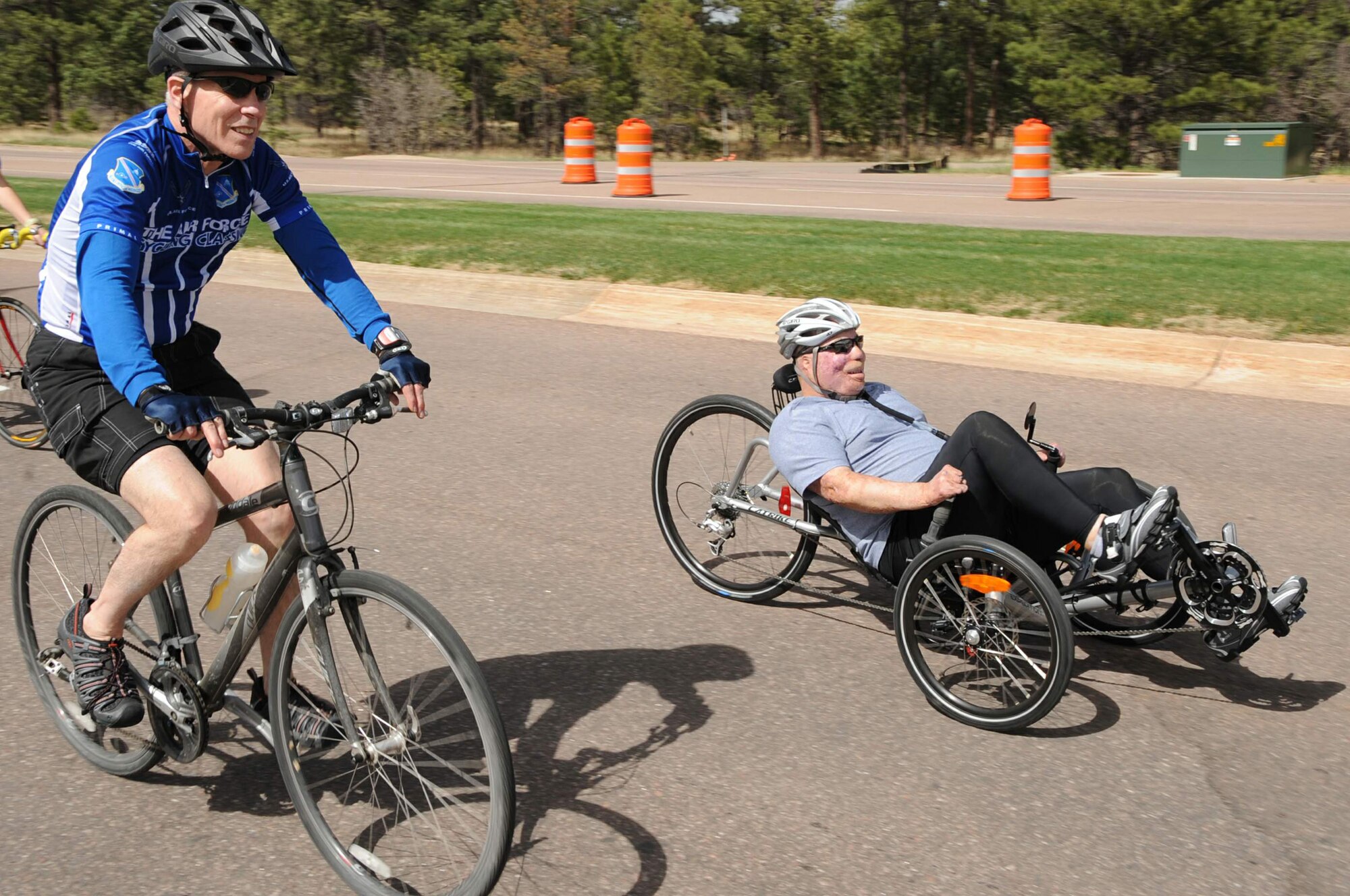 Tech. Sgt. Israel Del Toro and Gen. William Shelton finish the final mile of a six-mile Warrior Games cycling course May 8, 2011, during the team's practice at the Air Force Academy in Colorado Springs Colo. The 2011 Warrior Games are scheduled to run May 16 through 28. Sergeant Del Toro is a competitor at this year's Warrior Games, and General Shelton is the Air Force Space Command commander. (U.S. Air Force photo/Duncan Wood)
