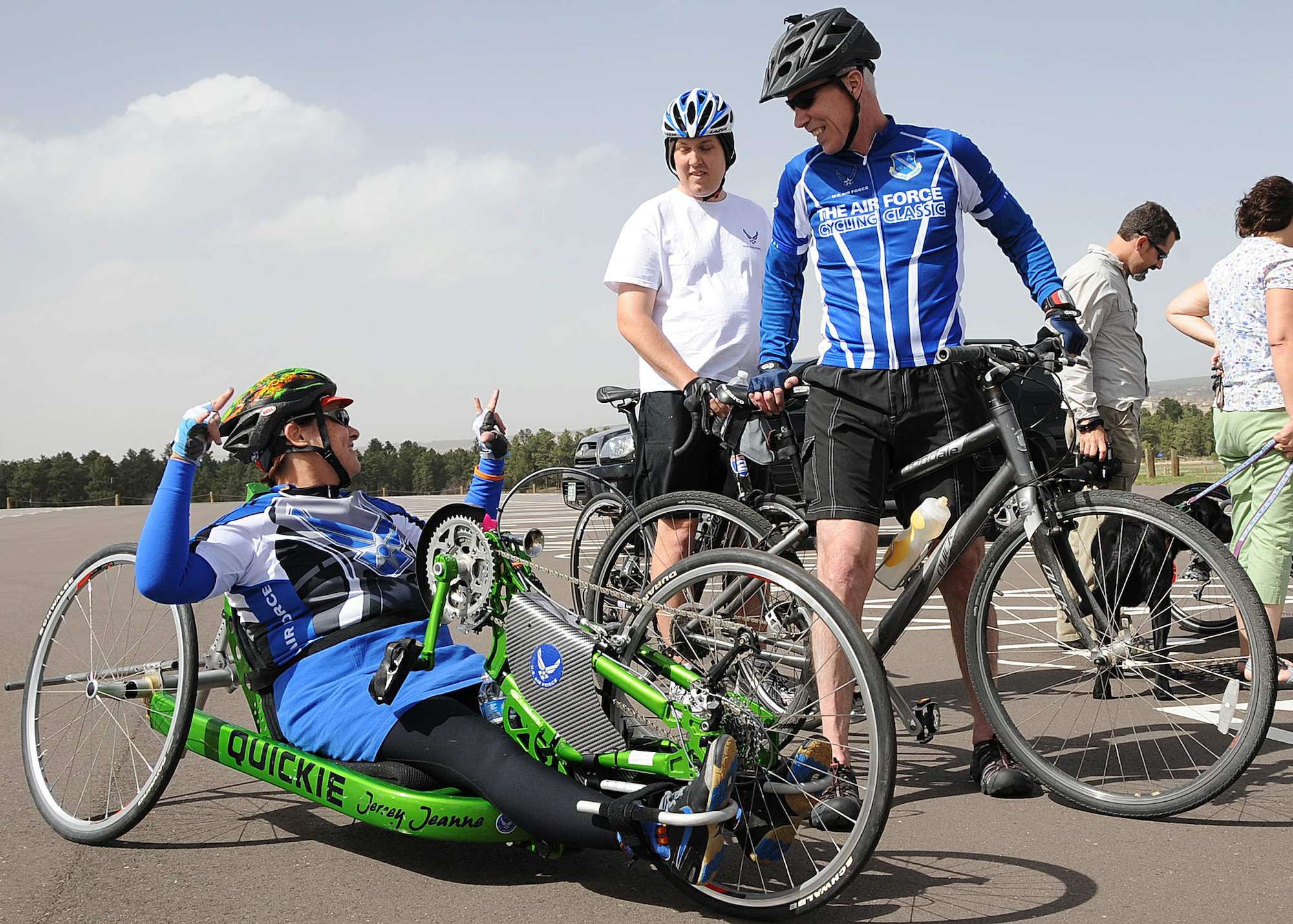 Retired Staff Sgt. Jeanne Goldy-Sanitate talks with Gen. William Shelton and retired Staff Sgt. Gregory Miller moments after completing a six-mile cycling course May 8, 2011, at the Air Force Academy in Colorado Springs, Colo. General Shelton spoke with the team at their morning breakfast and then joined them for cycling practice in the afternoon. The 2011 Warrior Games opening ceremony is scheduled for May 16. Sergeant Goldy-Sanitate and Sergeant Miller are Air Force competitors in the 2011 Warrior Games, and General Shelton is the Air Force Space Command commander. (U.S. Air Force photo/Duncan Wood)