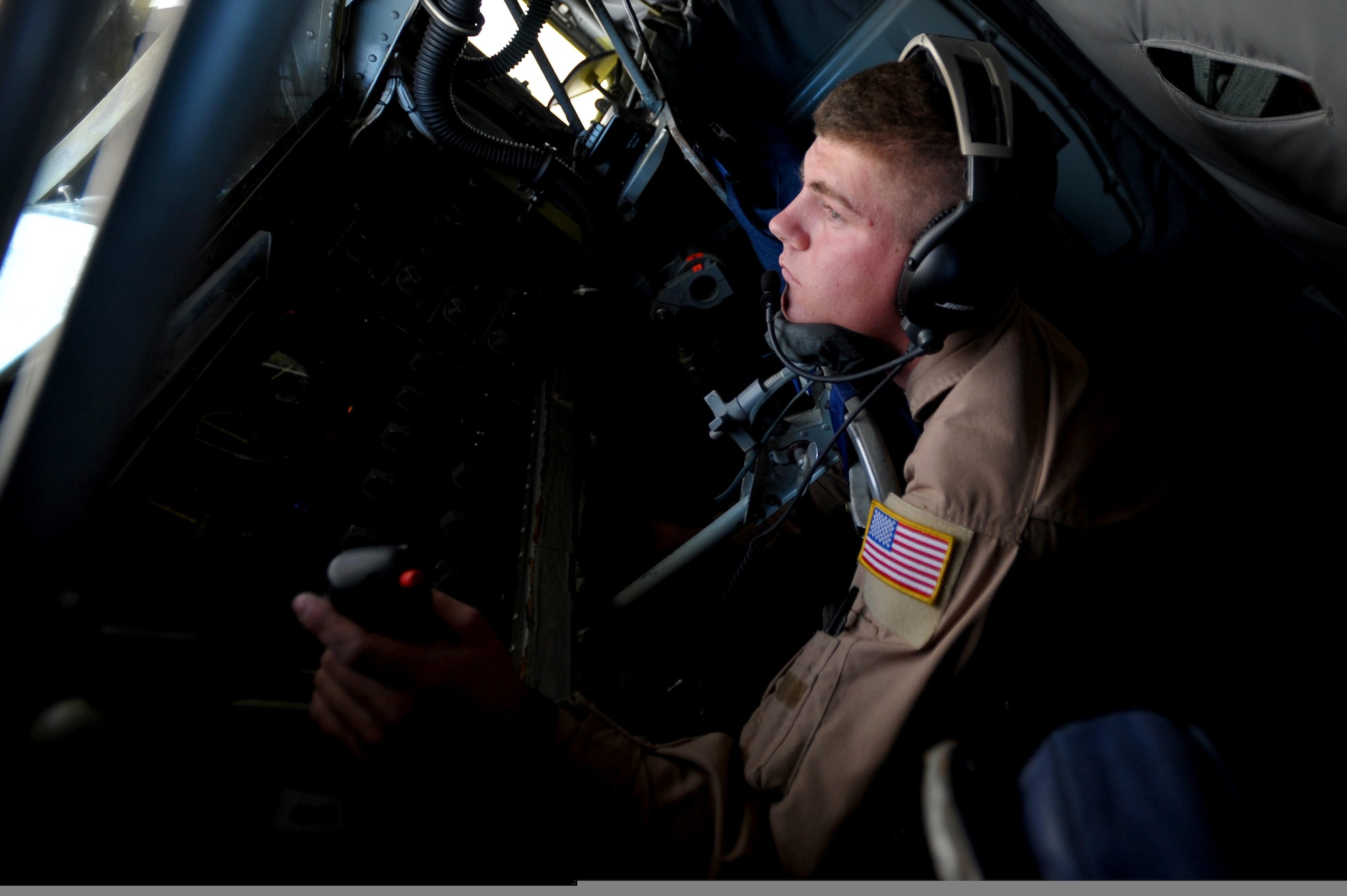 Airman 1st Class Michael Voorhees, a boom operator with the 340th Expeditionary Air Refueling Squadron, controls the air refueling boom on a KC-135 Stratotanker aircraft during a mission over Afghanistan on May 8, 2011, in support of Operation Enduring Freedom. Airman Voorhees is deployed from the 349th Air Refueling Squadron at McConnelll Air Force Base, Kan. (U.S. Air Force Photo/Master Sgt. William Greer)