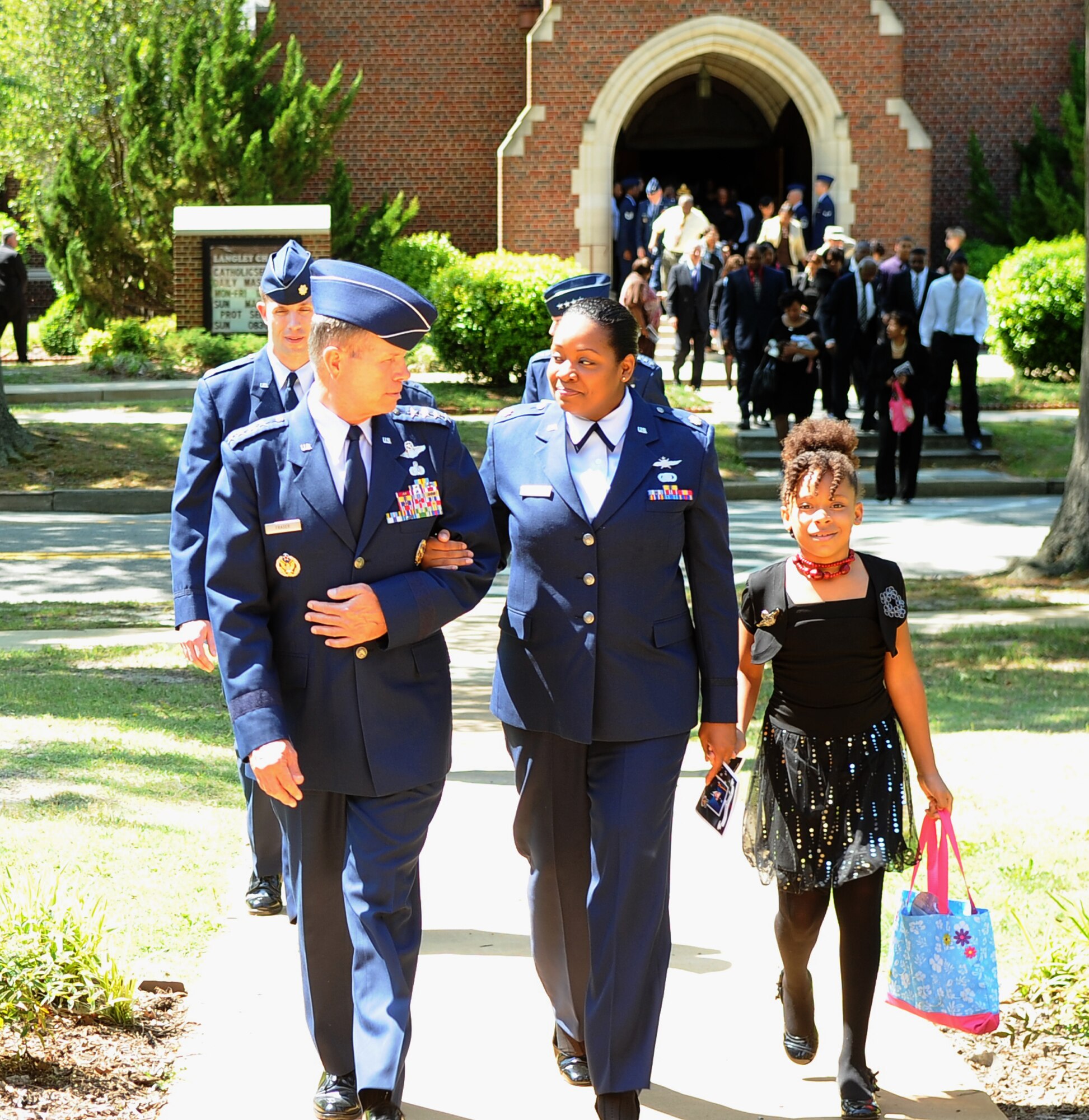 Gen. William Fraser, commander of Air Combat Command, escorts the family of Maj. Raymond Estelle II following the memorial service in his honor at the Langley Chapel at Langley Air Force Base, Va., May 11, 2011. Major Estelle, an Airman assigned to Headquarters Air Combat Command, died April 27 at the Kabul International Airport, Afghanistan, of wounds suffered from gunfire. (U.S. Air Force photo/Senior Airman Antoinette Gibson)(RELEASED)