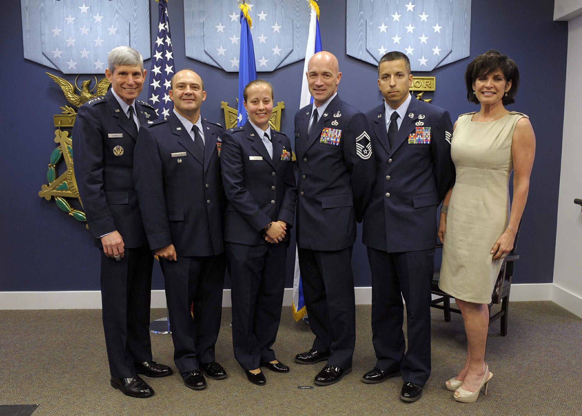 Air Force Chief of Staff Gen. Norton Schwartz and Janine Sijan Rozina flank this year's recipients of the 2010 Lance P. Sijan USAF Leadership Award during a ceremony May 11, 2011, in the Pentagon's Hall of Heroes. The recipients are (starting second from left) Lt. Col. Tony Millican, 1st Lt. Kathryn Miles, Senior Master Sgt. Brett Rogers and Staff Sgt. Michael Pereira.  Ms. Rozina is the younger sister of the award's namesake. The Sijan Award was created in 1981 to recognize individuals who demonstrate the highest qualities of leadership both in and out of uniform.  (U.S. Air Force photo/Jim Varhegyi)