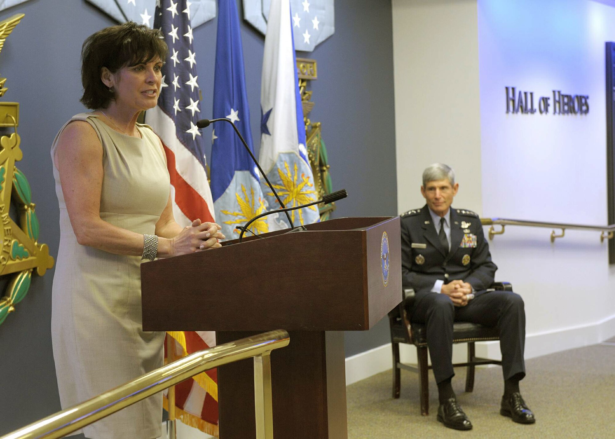 Janine Sijan Rozina provides remarks as Air Force Chief of Staff Gen. Norton Schwartz looks on during a ceremony May 11, 2011, in the Pentagon's Hall of Heroes where four recipients are each receiving a 2010 Lance P. Sijan USAF Leadership Award. Ms. Rozina is the younger sister of the award's namesake. The Sijan Award was created in 1981 to recognize individuals who demonstrate the highest qualities of leadership both in and out of uniform. (U.S. Air Force photo/Jim Varhegyi)