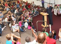 Rep. Charles Gonzalez reads to children at Lackland Elementary School during the Books on Bases Program Monday. The program, sponsored by Blue Star Families, brings attention to the special role military children play in the service to our country. The event included readings from Joint Base San Antonio leadership and a visit from Clifford the Big Red Dog. (U.S. Air Force photo/Robbin Cresswell)