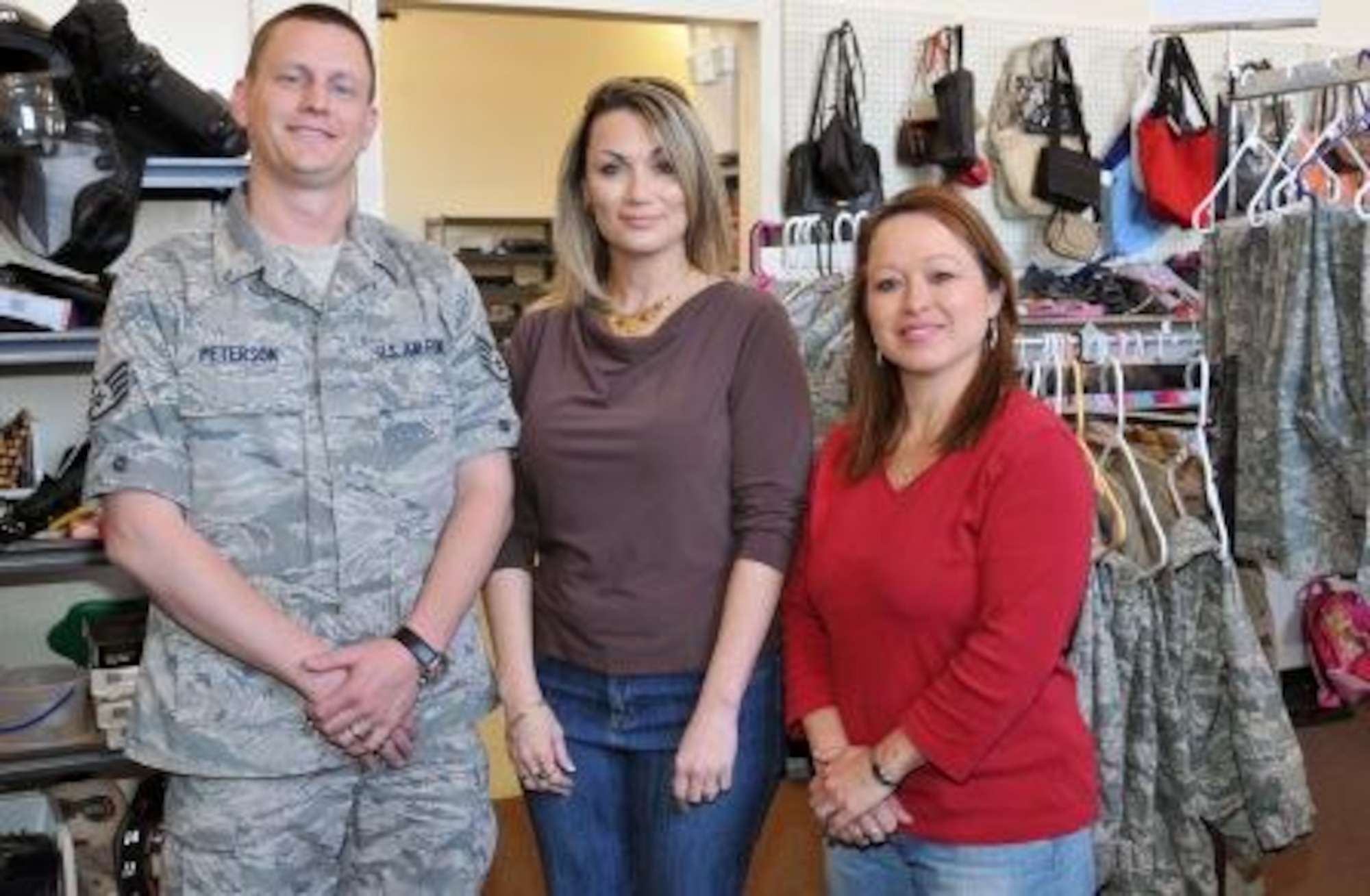 (Left to right) Staff Sgt. Nathan Peterson visits Kirtland Air Force Base Airman’s Attic Director Misty Hauge and Assistant Director Christie Wert. Sergeant Peterson developed the Airman’s Attic Directory website that serves as a focal point for information about host base’s Airman’s Attics.