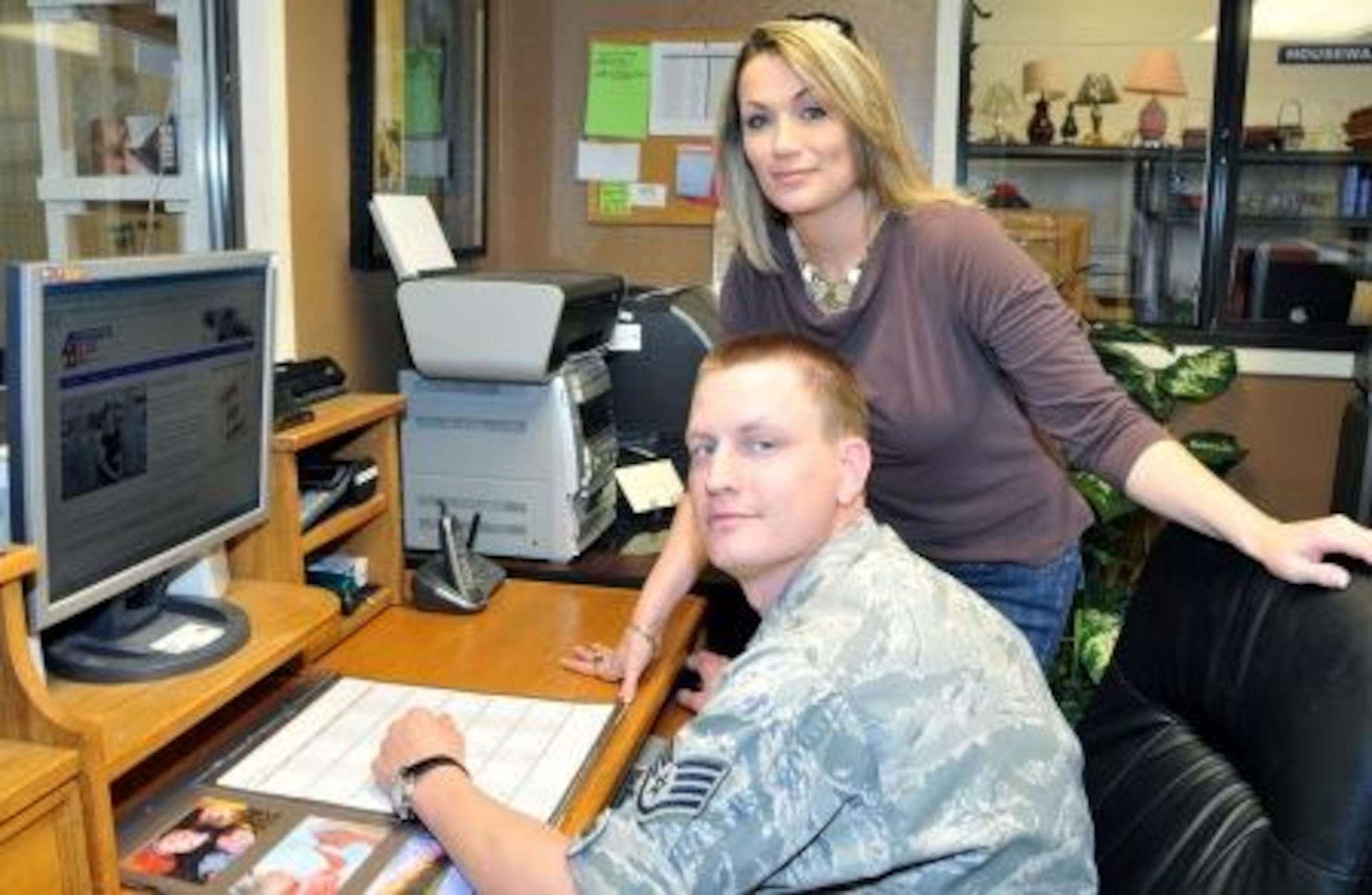 Staff Sgt. Nathan Peterson demonstrates the features of the Airman’s Attic Directory website to Misty Hauge, Kirtland Air Force Base, N.M., Airman’s Attic Director. The website is designed to be a one stop shop for information about Airman's Attics across the Air Force.