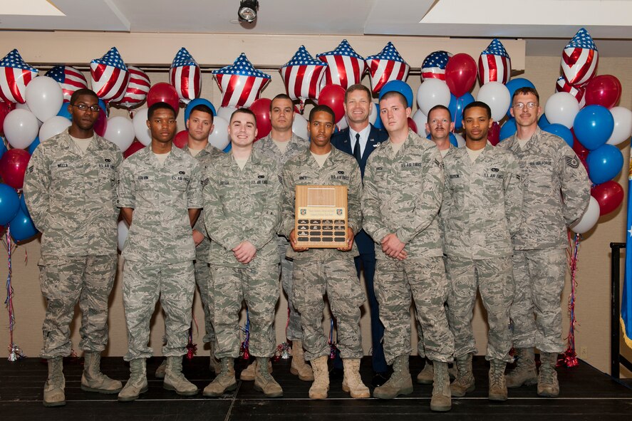 Members of the 23rd Logistics Readiness Squadron vehicle management flight receive an Outstanding Volunteer Team Award May 12 during the 2011 Annual Volunteer Recognition Ceremony at Moody Air Force Base, Ga. Last year, the group volunteered at the Hopes and Dreams Riding Facility and Habitat for Humanity.  They were responsible for the care of more than 25 horses and participated in events as part of social reintegration for post-traumatic stress disorder and special needs patients. Their carpentry efforts also helped build a house. (U.S. Air Force photo/Staff Sgt. Jamal D. Sutter)(RELEASED)