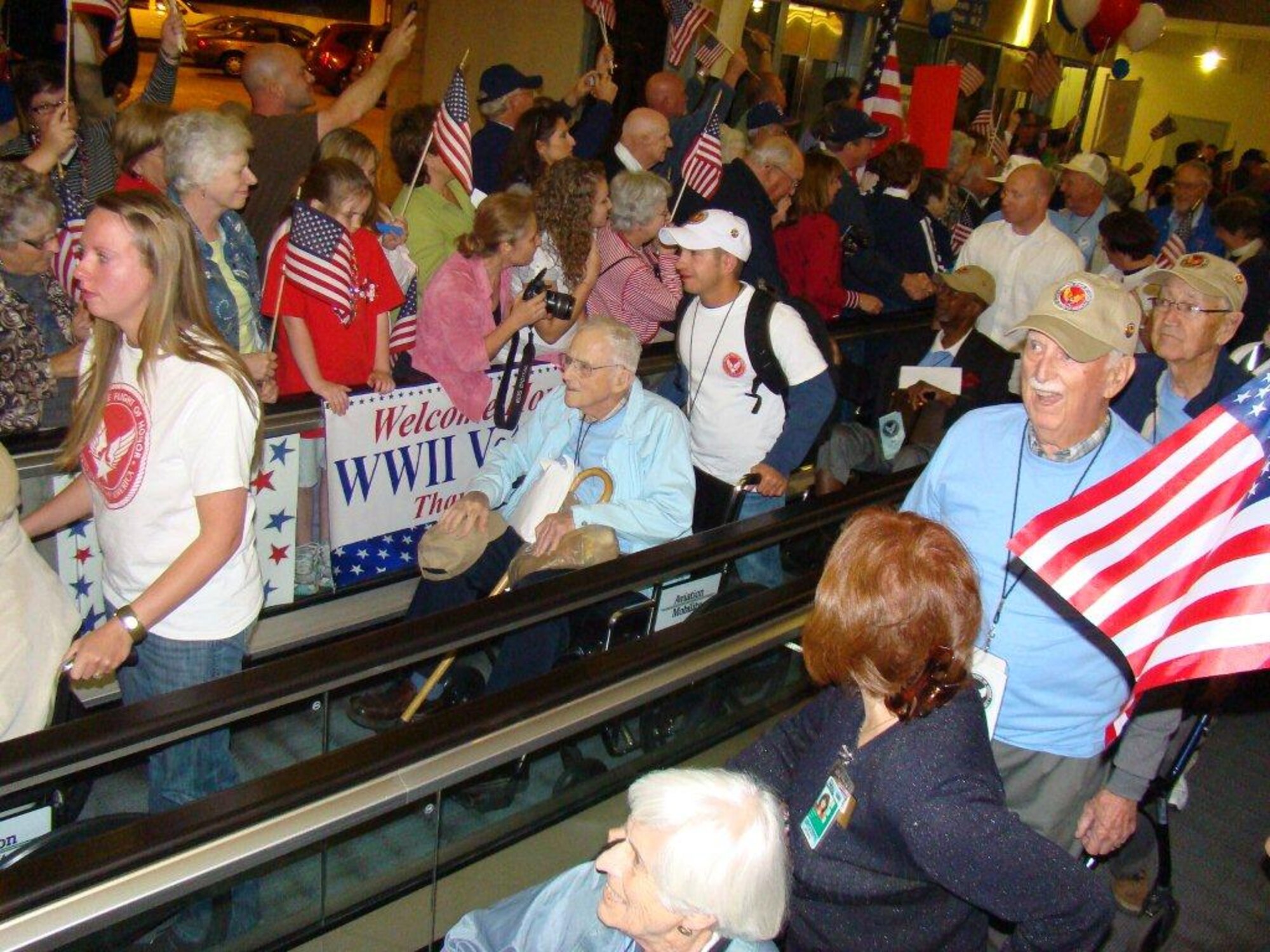 SEYMOUR JOHNSON AIR FORCE BASE, N.C. – Volunteers from across North Carolina assist veterans through the Raleigh-Durham International Airport for the “Flight of Honor “ May 4, 2011. The “Flight of Honor” is a program that takes World War II veterans to Washington, D.C., to view the WWII Memorial, Air Force Memorial, Air and Space Museum, Iwo Jima Memorial and Arlington National Cemetery. (Courtesy photo)