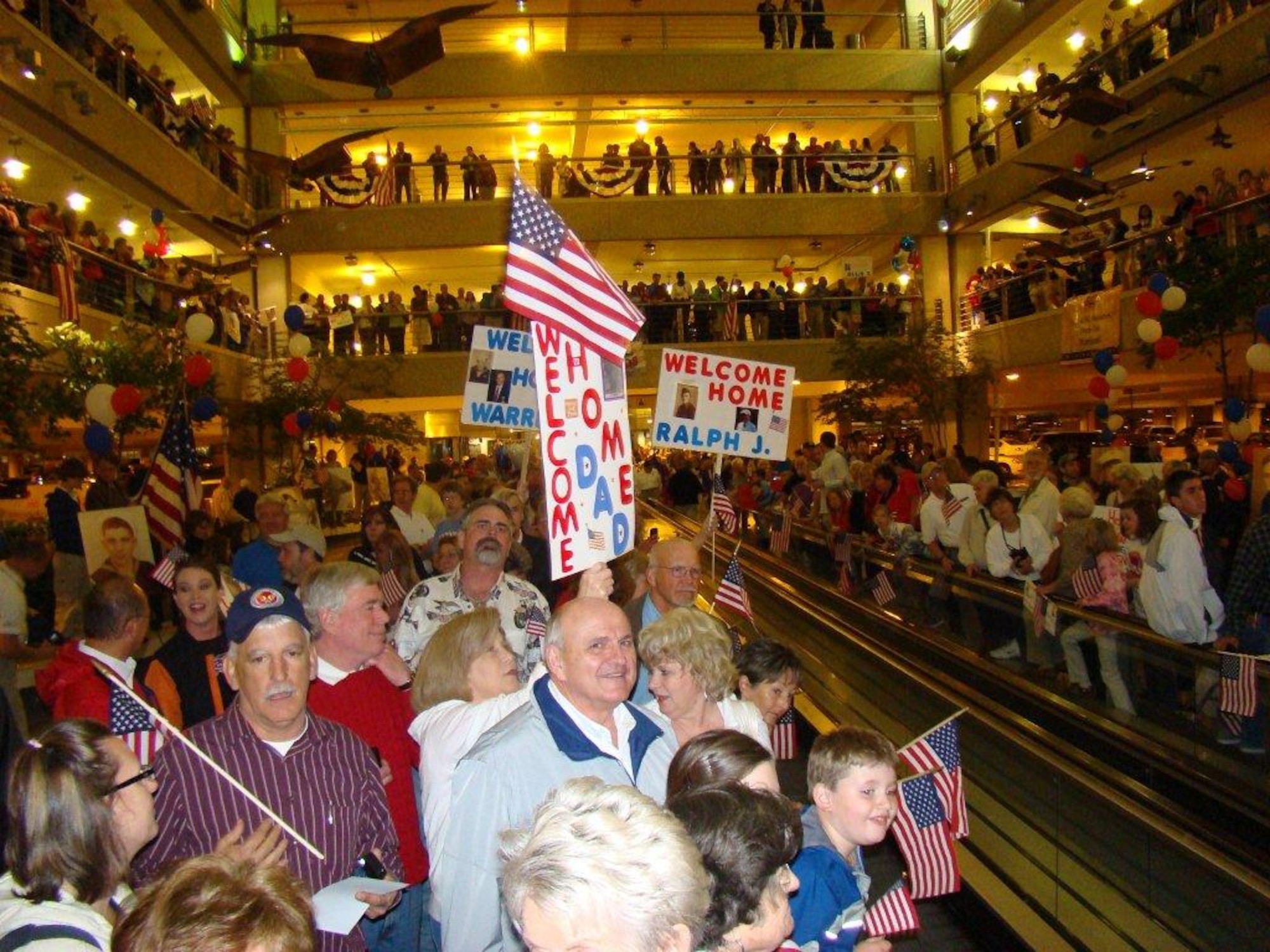 SEYMOUR JOHNSON AIR FORCE BASE, N.C. – Nearly 1,000 people wait to welcome home World War II veterans from the “Flight of Honor” trip at the Raleigh-Durham International Airport May 4, 2011. Volunteers escorted more than 100 veterans to Washington, D.C., to view the WWII Memorial, Air Force Memorial, Air and Space Museum, Iwo Jima Memorial and Arlington National Cemetery.  (Courtesy photo)