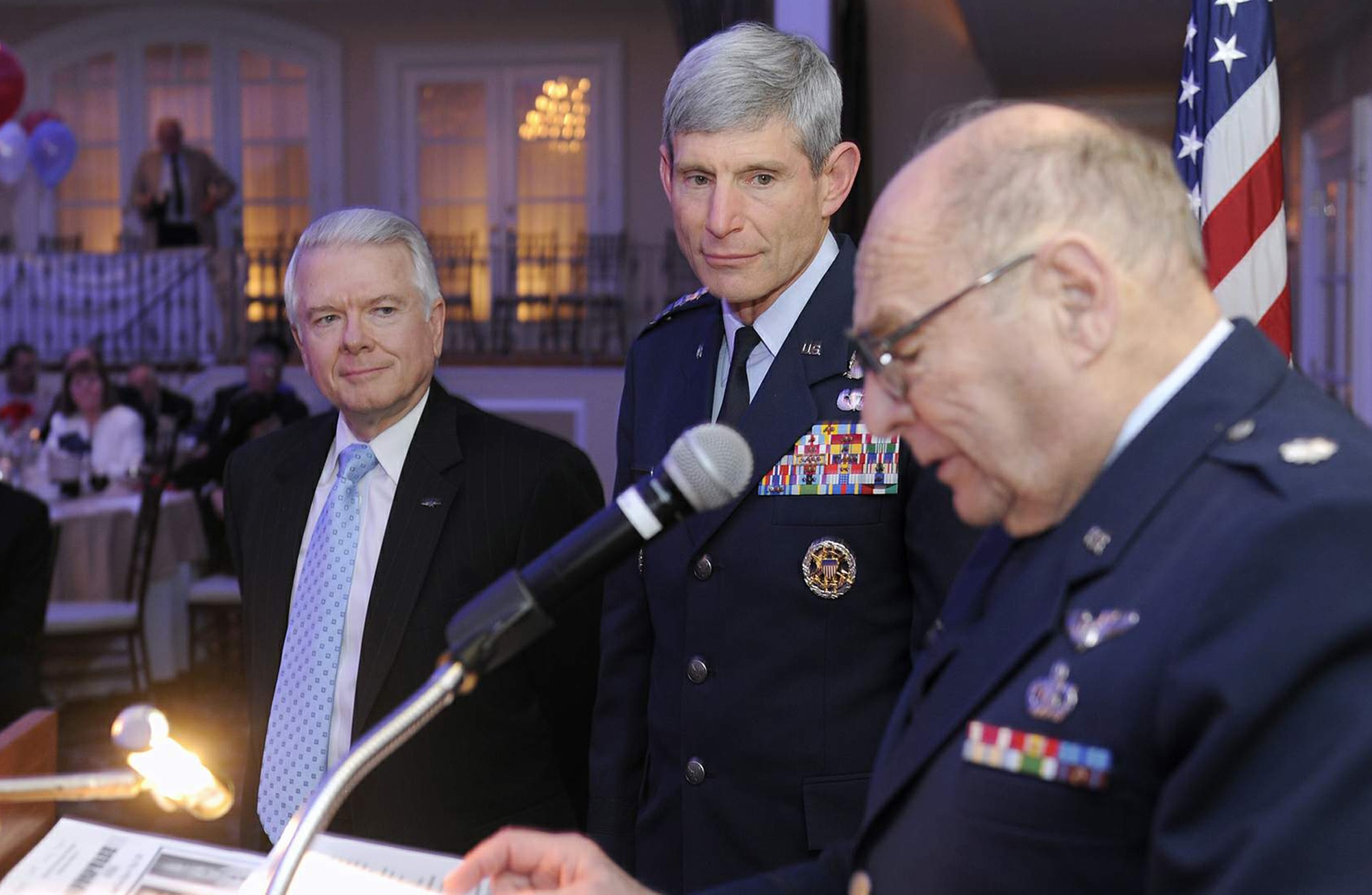Retired Lt. Col. Stephen Riethof, an inductee in the New Jersey Aviation Hall of Fame, reads a personal letter on behalf of Secretary of the Air Force Michael Donley to Air Force Chief of Staff Gen. Norton Schwartz May 11, 2011, during the New Jersey Aviation Hall of Fame induction ceremony in Teterboro, N.J..  Looking on is W. Timothy McSwain, a former president of the hall of fame. General Schwartz, who shared the spotlight with three other inductees, was also the keynote speaker at the ceremony.  (U.S. Air Force photo/Scott Ash)