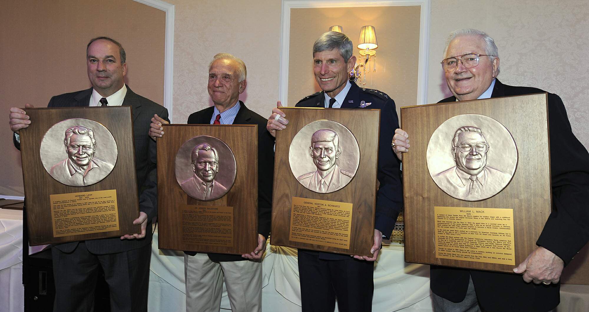 Air Force Chief of Staff Gen. Norton Schwartz poses for a photograph with three other honorees May 11, 2011, during an induction ceremony into the New Jersey Aviation Hall of Fame in Teterboro, N.J.  Joining the general were, from left, Glenn Stott, accepting on behalf of Howard Levy, an aviation photographer; Dr. Joseph Salvatore, founder of the Naval Air Station Wildwood Museum, the largest aviation museum in New Jersey; and William Mack, a jet speed record-setter and avionics designer.  General Schwartz is a native of Toms River, N.J.  (U.S. Air Force photo/Scott Ash)