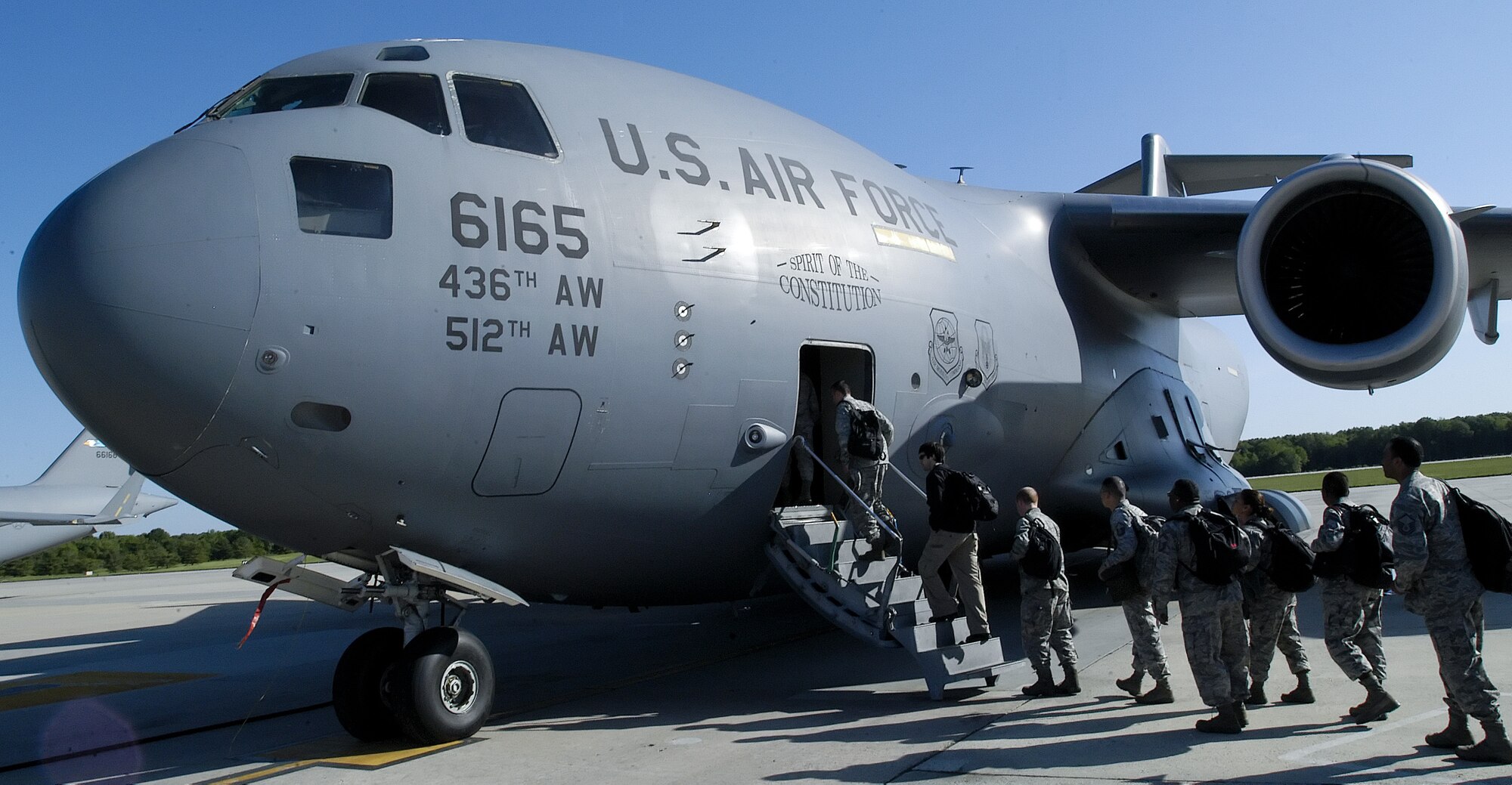 Team Dover members board a C-17 Globemaster III May 11, 2011, at Dover Air Force Base, Del., en route to Gulfport-Biloxi International Airport, Miss., to survey the site of the upcoming Operation Readiness Inspection in December. The ORI has servicemembers simulate operations as if they were deployed. “The servicemembers at [GBIA] were great hosts while we got oriented with the base,” said Maj. Jonathan Diaz, 9th Airlift Squadron ORI lead planner. “We’re ready to prove that we can survive and operate anywhere.”  (U.S. Air Force photo by Airman 1st Class Samuel Taylor)