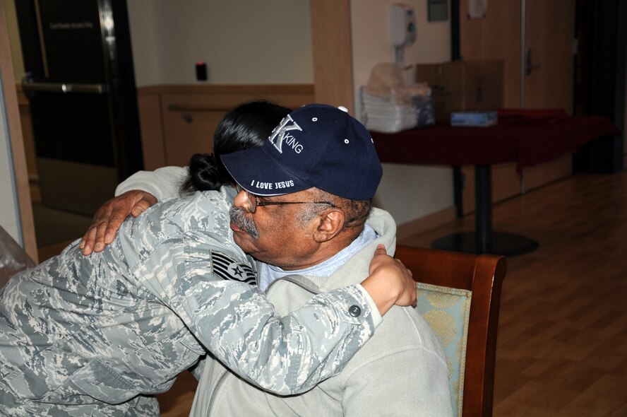 Tech. Sgt. Jennifer Jankford, a 446th Security Forces Squadron specialist, embraces Mr. Benjamin Newman, a Korean War veteran, during a visit to the American Lake Veternans hospital on April 30. Sergeant Jankford visited the hospital to thank local veterans for their service as part of the Visit a Vet program. (U.S. Air Force photo by 2nd Lt. Denise Hauser/Released)