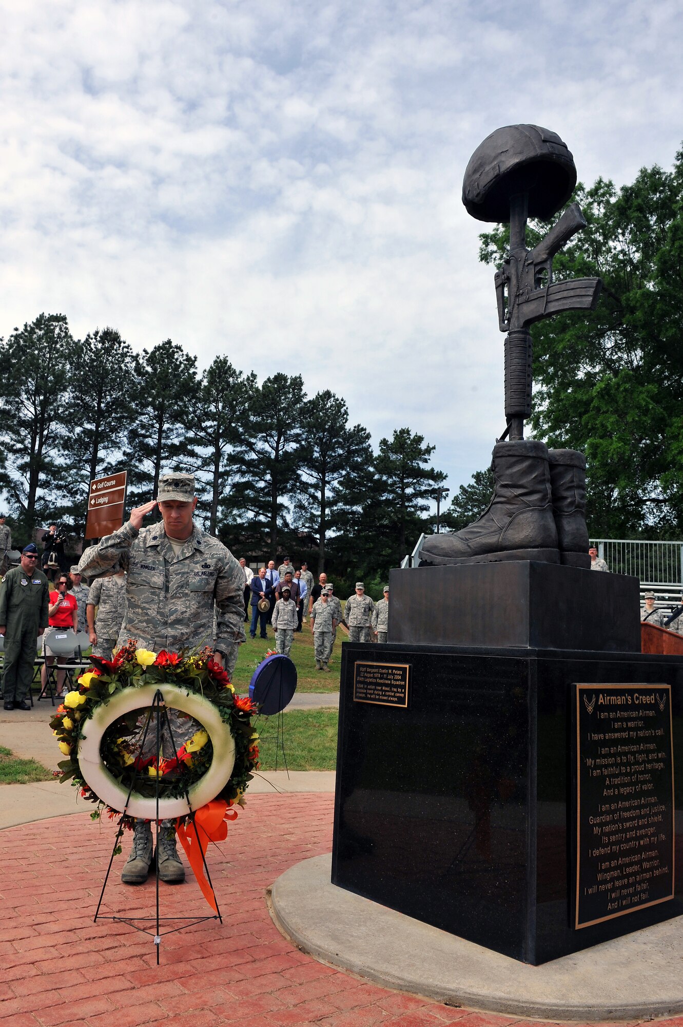 Lt. Col. John Winkler, 19th Logistic Readiness Squadron commander, pays respects to the base’s two fallen Airman during a wreath laying memorial service May 12, 2011, on Little Rock Air Force Base, Ark. Team Little Rock performs the ceremony every year to remember the two NCOs who gave their lives supporting Operation Iraqi Freedom. (U.S. Air Force photo/Staff Sgt. Chris Willis)