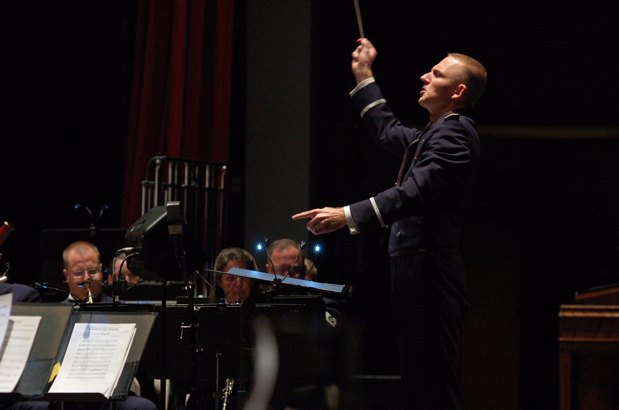2nd Lieutenant Joseph Hansen conducts the Concert Band during Fiesta in Blue 2011.