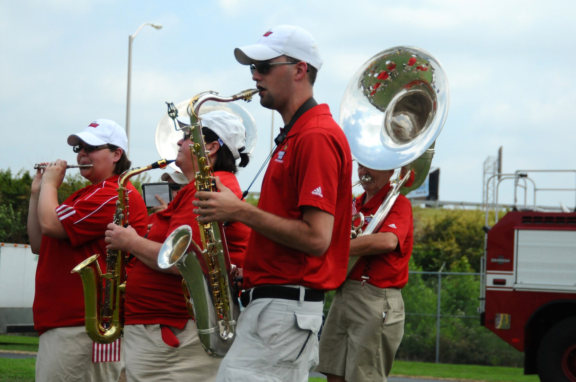 Members of the University of Louisville Marching Band perform for military families and friends at the Kentucky Air National Guard 123rd Airlift Wing “Family Day” event July 17, 2010. Guests were treated to barbecue, games, entertainment, rides and opportunities to learn about services available to members of the military community. (U.S. Air Force photo by Master Sgt. Phil Speck)