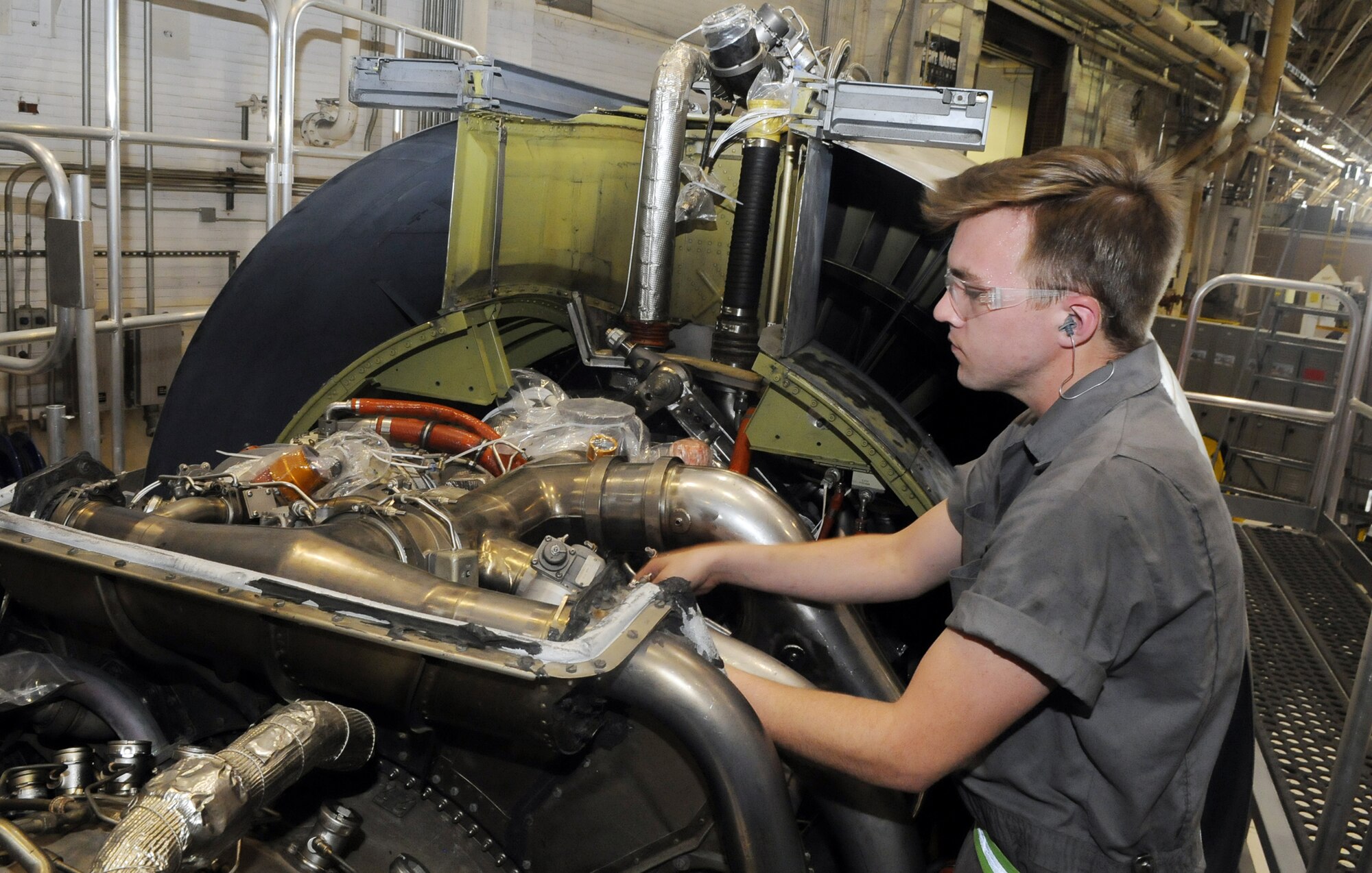 Isaiah Wood works on a C-5 engine. U. S. Air Force photo by Sue Sapp