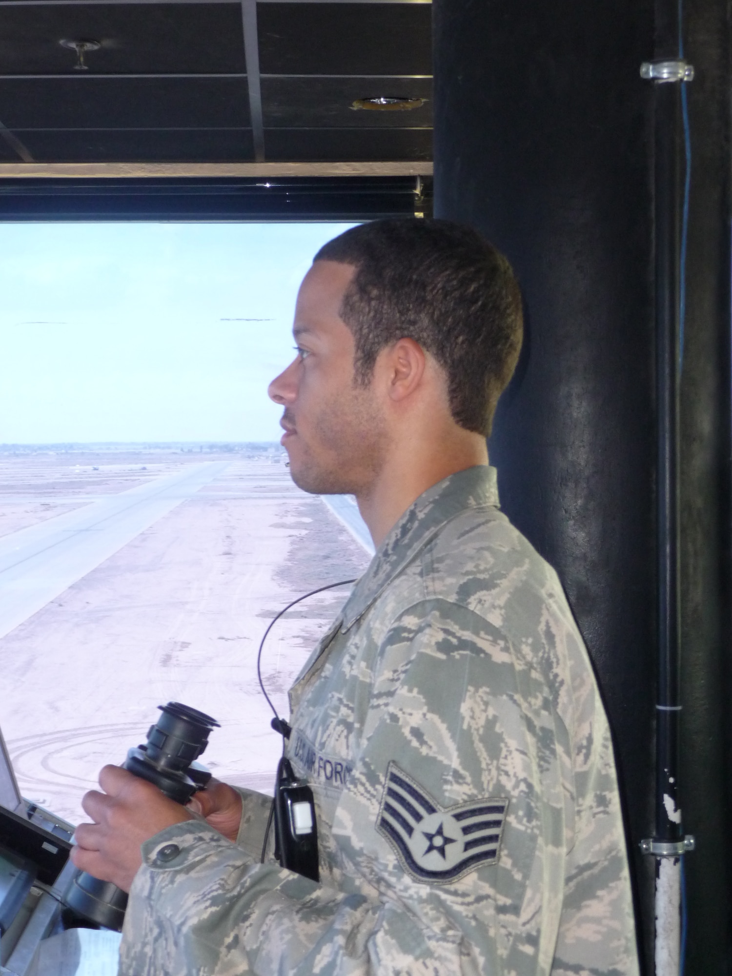 Staff Sgt. Tyrone Bowles is deployed to the 332d Expeditionary Operations Support Squadron from the 1st Operations Support Squadron, serving as an air traffic controller tower watch supervisor. Sergeant Bowles supports the mission by getting aircraft airborne in a timely manner in order to support ground troops and active surveillance missions in Iraq. in addition, he ensures the safest and quickest route possible for helicopters on urgent medical evacuation procedures. (Photo courtesy/Senior Master Sgt. Ivan Blanco/Released)

