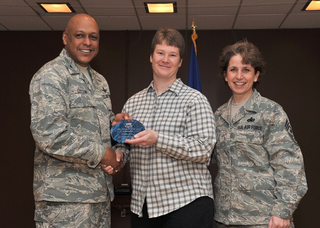 Amia R. Watson, 341st Medical Operations Squadron, center, was named the 341st Missile Wing's Category I Civilian of the Quarter for the first quarter of 2011 at the Wing Quarterly Awards breakfast held April 9, 2011 at Malmstrom AFB's Grizzly Bend Club.  Shown presenting the award are Col. Anthony J. Cotton, 341st Missile Wing commander, and Chief Master Sgt. Cari A. Kent, 341st MW command chief.  (U.S. Air Force photo/ John Turner)