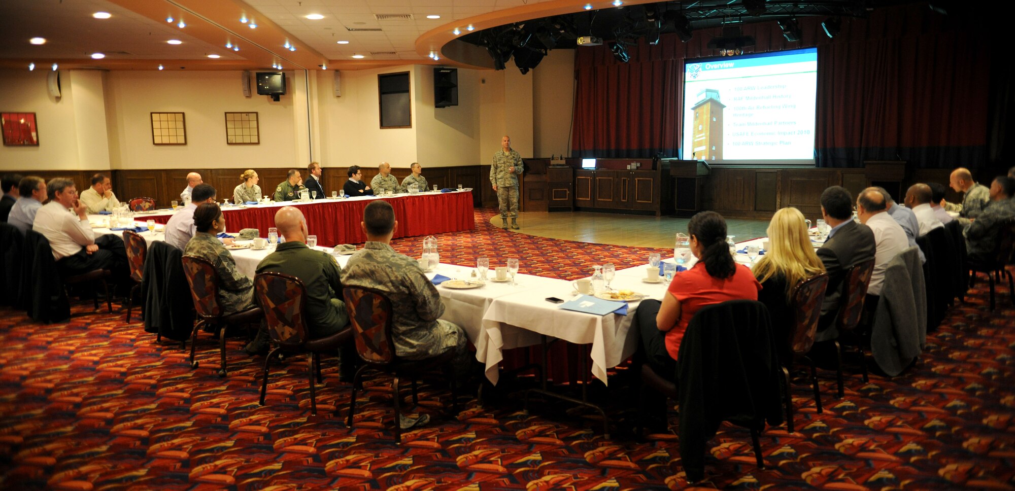 RAF MILDENHALL, England – Col. Chad Manske, 100th Air Refueling Wing commander, briefs visiting members of the Newmarket Chamber of Commerce during a breakfast meeting at the Galaxy Club May 12, 2011. Colonel Manske explained the history, facts and mission impact of Team Mildenhall while also addressing the roles and responsibilities that Airmen play in the local community. The purpose of the visit was to strengthen partnerships, relations, business and social links between the local community and the U.S. Military. (U.S. Air Force photo/Tech Sgt. Jerry Fleshman)