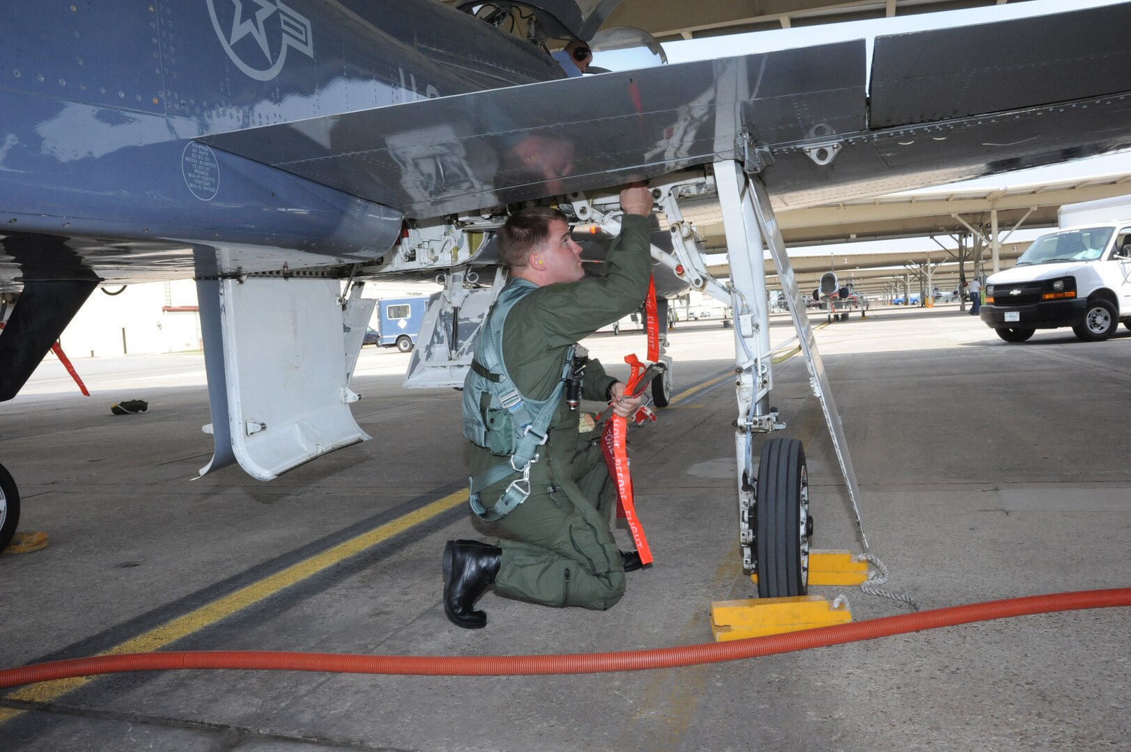 Lt. David Brandon, 435th Fighter Training Squadron, performs a final walk-around safety check of his T-38 Talon Aircraft prior to a morning training mission at Randolph Air Force Base, Texas May 9, 2011.(U.S. Air Force photo/Rich McFadden)