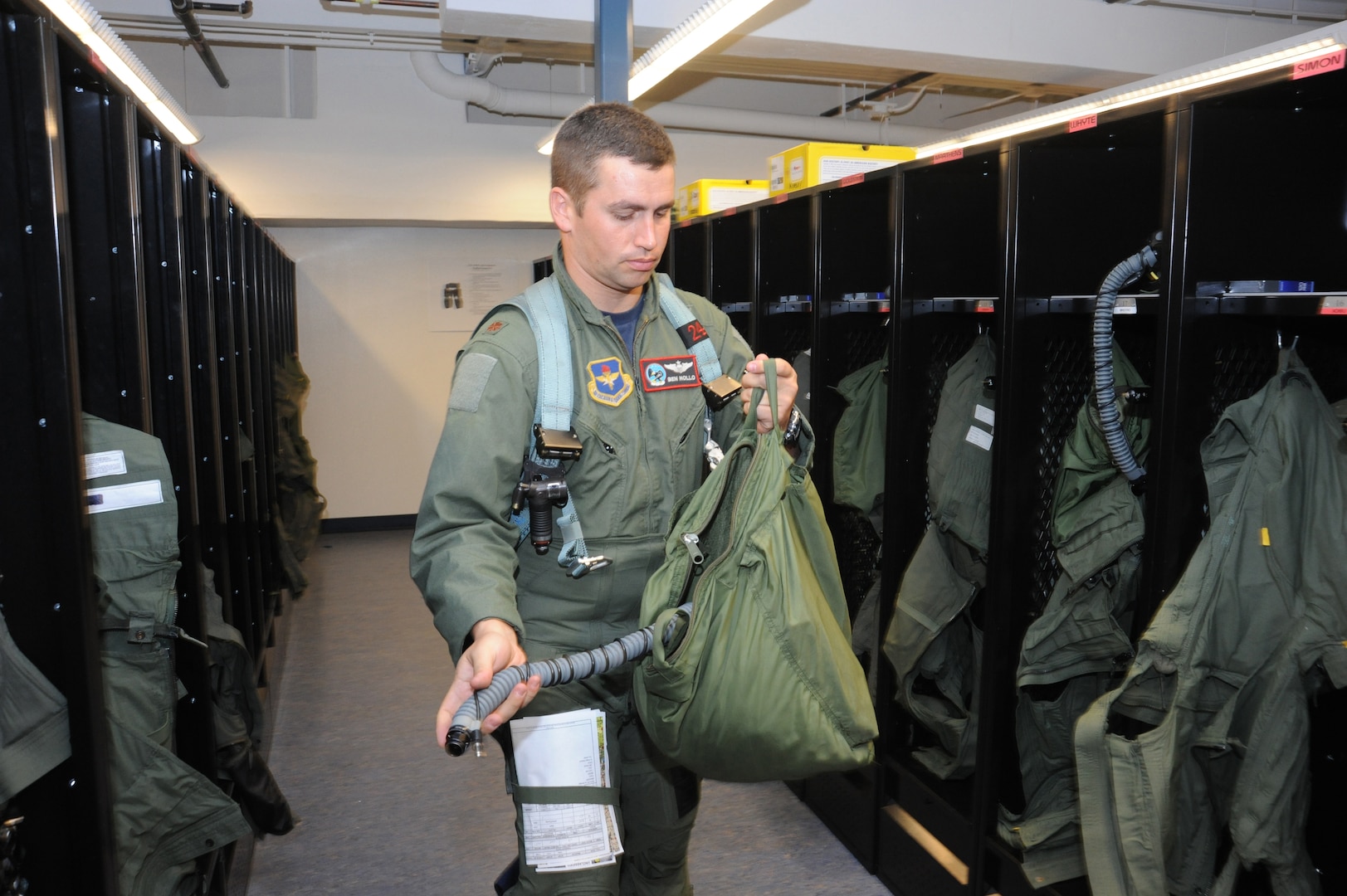 Maj. Ben Hollo,435th FighterTraining Squadron Introduction to Fighter Fundamentals instructor pilot, checks out his life support equipment, prior to a training mission at Randolph Air Force Base, Texas  May 9, 2011(U.S. Air Force photo/Rich McFadden)