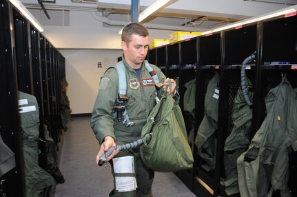 Maj. Ben Hollo,435th FighterTraining Squadron Introduction to Fighter Fundamentals instructor pilot, checks out his life support equipment, prior to a training mission at Randolph Air Force Base, Texas  May 9, 2011(U.S. Air Force photo/Rich McFadden)