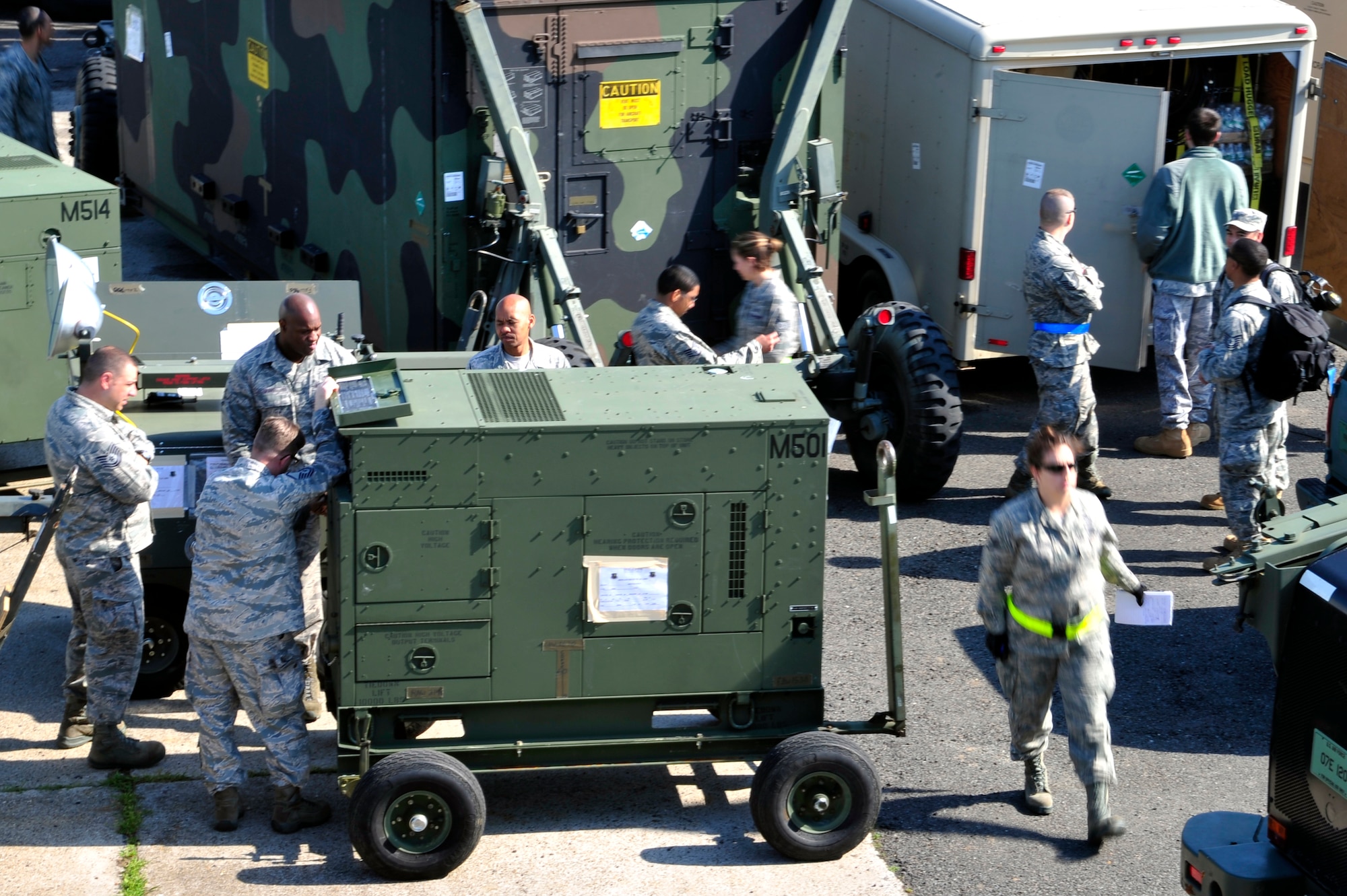 Members of the 621st Contingency Response Element inspect equipment at Mihail Kogalniceanu Air Base, Romania, May 10.  Fifty-four members of the 621st Contingency Response Wing deployed here to extend airfield capability supporting multi-modal operations during a U.S. Transportation Command proof-of-principle evaluation. The process is expected to demonstrate the feasibility of using the air base as a hub for equipment flowing into and out of Afghanistan.  (U.S. Air Force photo by Master Sgt. Laura K. Deckman/released)