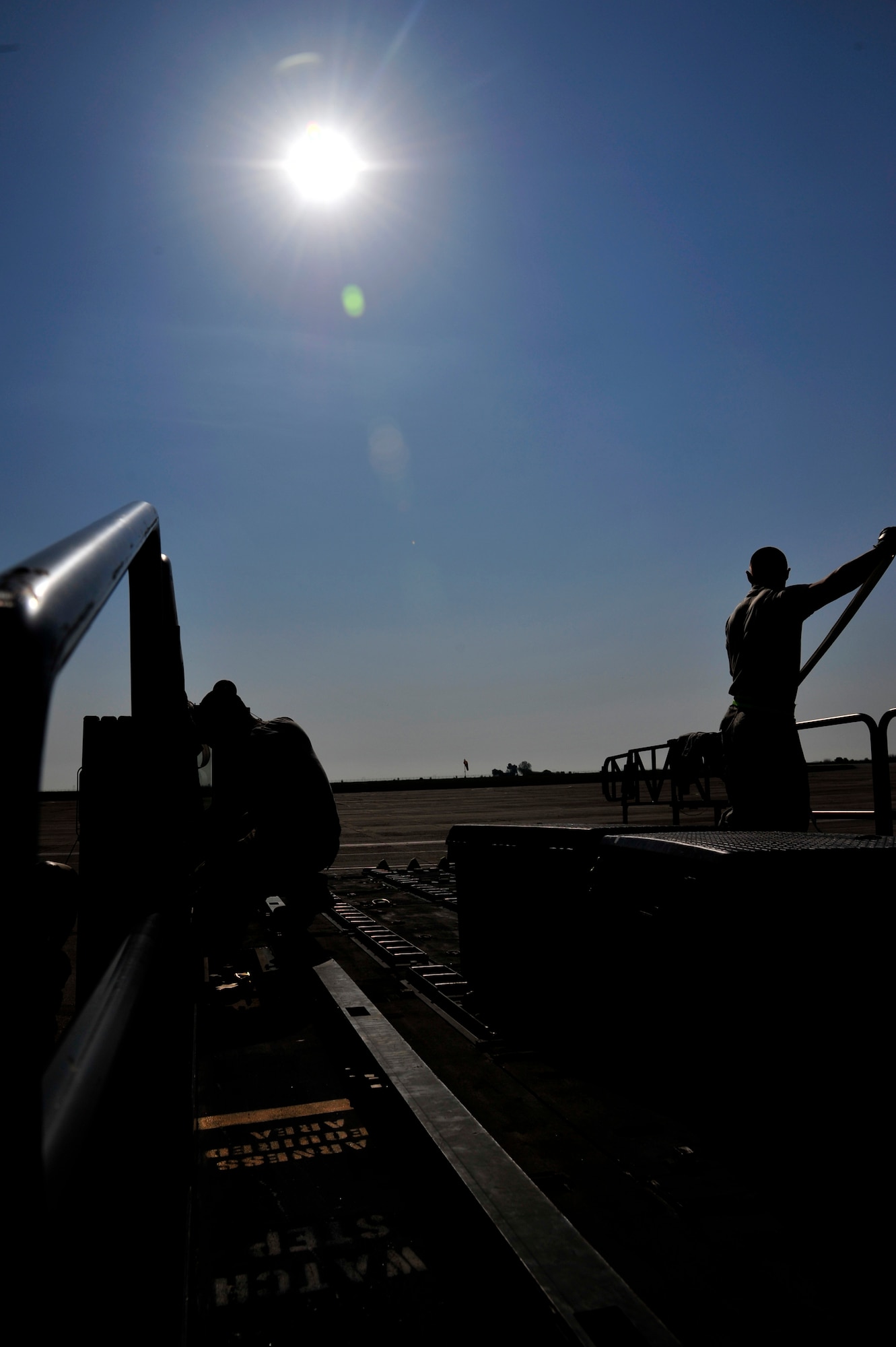 Members of the 621st Contingency Response Element inspect equipment at Mihail Kogalniceanu Air Base, Romania, May 10.  Fifty-four members of the 621st Contingency Response Wing deployed here to extend airfield capability supporting multi-modal operations during a U.S. Transportation Command proof-of-principle evaluation. The process is expected to demonstrate the feasibility of using the air base as a hub for equipment flowing into and out of Afghanistan.  (U.S. Air Force photo by Master Sgt. Laura K. Deckman/released)
