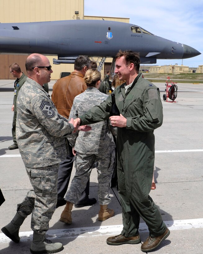 Col. Jeffrey Taliaferro (right), 28th Bomb Wing commander, returns from his end of tour flight and is congratulated by Chief Master Sgt. Brian Lavoie, 28th BW command chief at Ellsworth Air Force Base, S.D., May 3, 2011.   Col. Taliaferro took command of the 28th BW on June 4, 2009 and will relinquish command to Col. Mark Weatherington during a ceremony on May 13, 2011. (U.S. Air Force photo/Staff Sgt. Marc I. Lane)