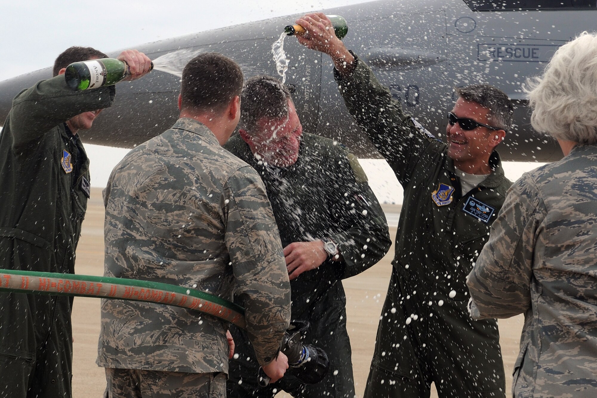 KUNSAN AIR BASE, Republic of Korea -- Col. John Dolan, 8th Fighter Wing commander, gets hosed down with water from the fire truck after his fini flight here May 12. A fini flight is symbolic of a pilot's final flight with a particular squadron or aircraft. (U.S. Air Force photo/Senior Airman Brittany Y. Bateman)