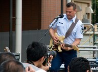 NERIMA CITY, Japan -- Master Sgt. Gary Rosenak, Pacific Trends guitarist, performs at the Japan Ground Self-Defense Force Public Information Center, Nerima City, Japan, May 8, 2011. The band held the concert to show their support for those affected by the 9.0-magnitude earthquake and subsequent tsunami that occurred March 11, 2011. (U.S. Air Force photo/Airman John Partlow)