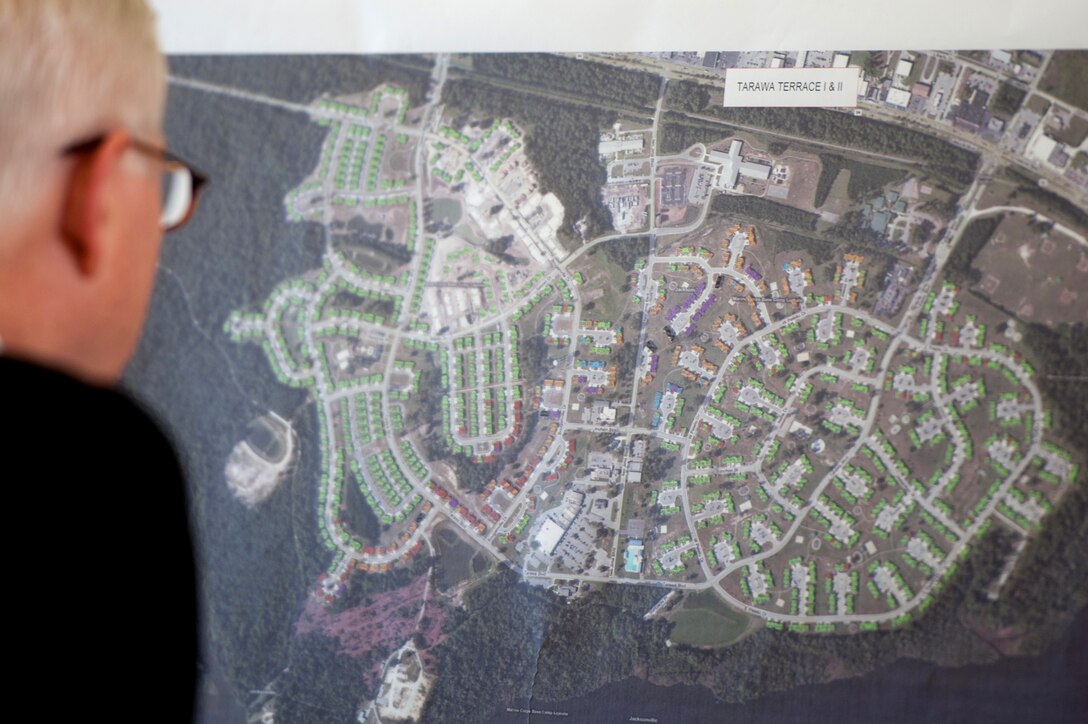 U.S. Defense Secretary Robert M. Gates views a map indicating recent tornado damage to military housing on Camp Lejeune, N.C., May 12, 2011. Gates visited the base April 16 to survey the damaged base housing.