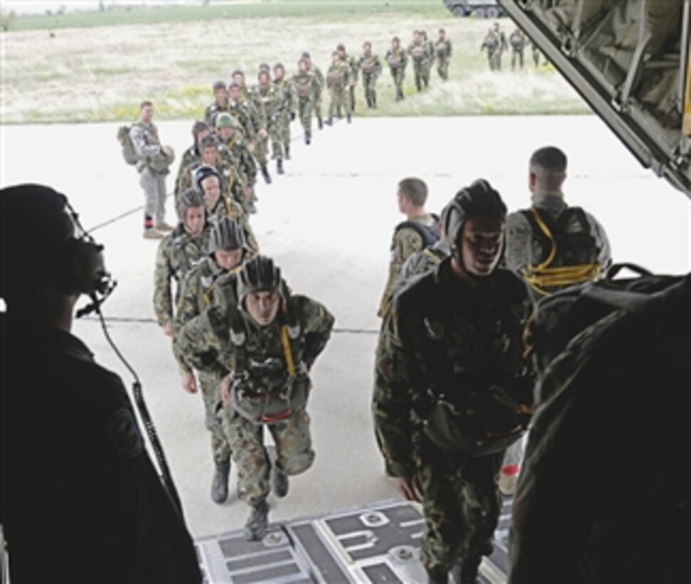 Members from the 435th Security Forces Squadron usher more than 50 Bulgarian air force paratroopers into a C-130J Super Hercules aircraft in support of Thracian Spring 2011 in Plovdiv, Bulgaria, on April 29, 2011.  