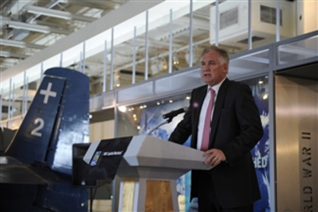 Deputy Secretary of Defense William J. Lynn III addresses the audience at the RBC Capital Markets' Aerospace & Defense Conference in the hangar deck of the USS Intrepid Sea, Air and Space Museum in New York, N.Y., on May 11, 2011.  
