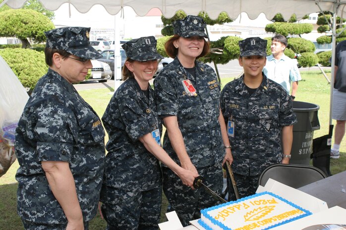 Lt. Cmdr. Stella Annunziato, Robert M. Casey Medical and Dental Clinic education and training urgent care clinic department head of staff, Navy Lt. Sarah E. Gentry, Branch Health Clinic staff nurse, Cmdr. Sherri R. Coleman, BHC senior nurse officer, and Navy Lt. Beverly J. Torres, BHC staff nurse, cut a cake celebrating the 103rd birthday of the Navy Nurse Corps at the BHC here May 13. The Nurse Corps has aided service members in times of war, providing medical care and comfort for all service branches. The Nurse Corps’ rich tradition can be traced back to the Angels of Bataan, the first group of female service members taken as prisoners of war during World War II.