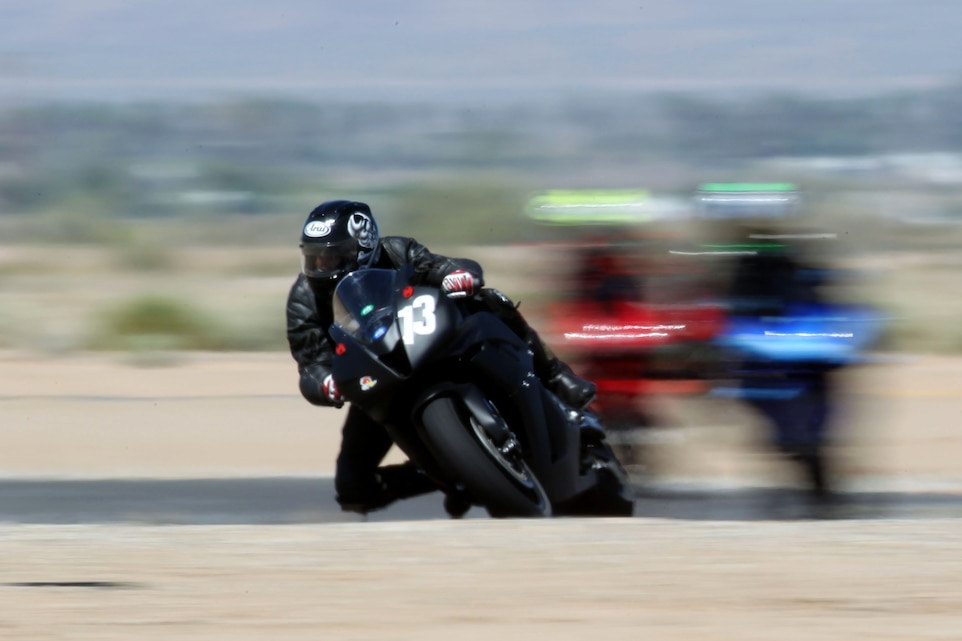 Frank Santiago, a rider coach for base safety, flies around a corner of Chuckwalla Valley Raceway, practicing what he has learned from classes during a Jason Pridmore’s Star School class sponsored by the Combat Center’s Base Safety May 13, 2011.