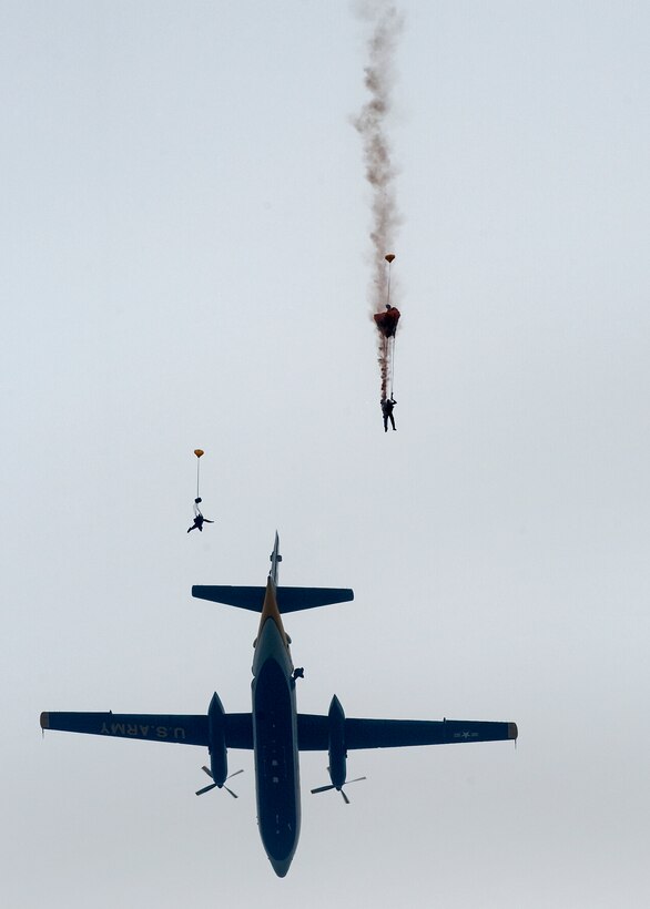 Members of the U.S. Army Parachute Team Golden Knights jump from a C-31A during the "Airpower over Hampton Roads" Open House at Langley Air Force Base, Va., May 13, 2011.   The open house helps to educate the public on past and present Air Force aerial capabilities, increase recruiting and show appreciation to the local community. (U.S. Air Force photo/Senior Airman Zachary Wolf)(RELEASED)