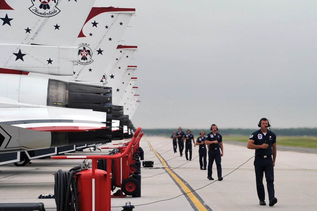 The U.S. Air Force Air Demonstration Squadron, Thunderbirds, team members prepare their F-16 Fighting Falcons prior to take-off during the AirPower over Hampton Roads open house at Langley Air Force Base, Va., May 13, 2011. The Thunderbirds headlined the open house and performed precision aerial maneuvers, demonstrating the capabilities of high-performance aircraft to the Hampton Roads area. (U.S. Air Force photo by Airman 1st Class Camilla Griffin/RELEASED)

