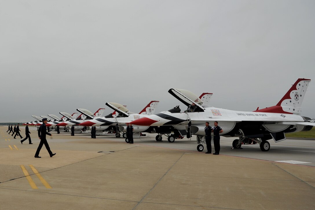 The U.S. Air Force Air Demonstration Squadron, Thunderbirds, pilots approach their F-16 Fighting Falcons prior to a performance during the AirPower over Hampton Roads open house at Langley Air Force Base, Va., May 13, 2011. Thunderbirds headlined the open house and performed precision aerial maneuvers, demonstrating the capabilities of high-performance aircraft to the Hampton Roads area. (U.S. Air Force photo by Airman 1st Class Camilla Griffin/RELEASED)