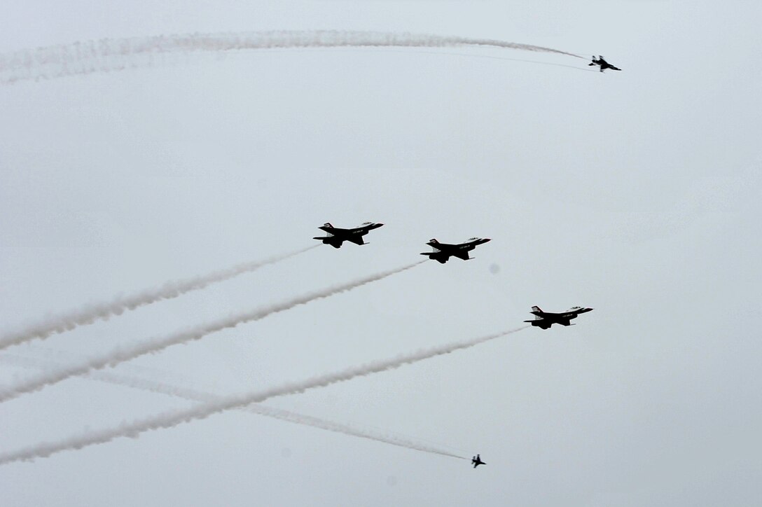 The U.S. Air Force Air Demonstration Squadron, the Thunderbirds, perform precision aerial maneuvers during the AirPower over Hampton Roads open house at Langley Air Force Base, Va., May 13, 2011. The Thunderbirds headlined the open house, demonstrating the capabilities of high-performance aircraft to the Hampton Roads area. (U.S. Air Force photo by Airman 1st Class Camilla Griffin/RELEASED)