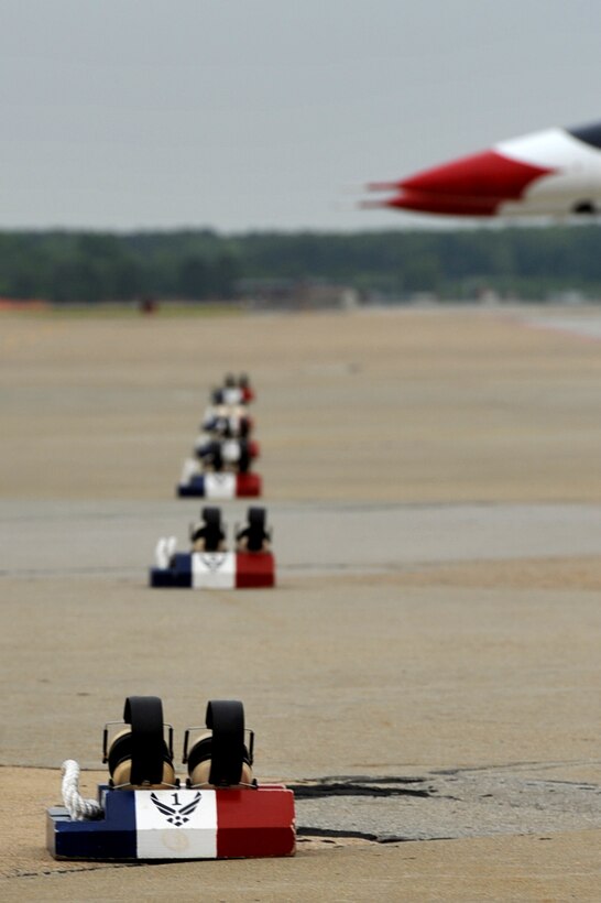 Gear belonging to the U.S. Air Force Air Demonstration Squadron, Thunderbirds, rests along the flightline during the AirPower over Hampton Roads open house at Langley Air Force Base, Va., May 13, 2011. The Thunderbirds headlined the open house and performed precision aerial maneuvers, demonstrating the capabilities of high-performance aircraft to the Hampton Roads area. (U.S. Air Force photo by Airman 1st Class Camilla Griffin/RELEASED)