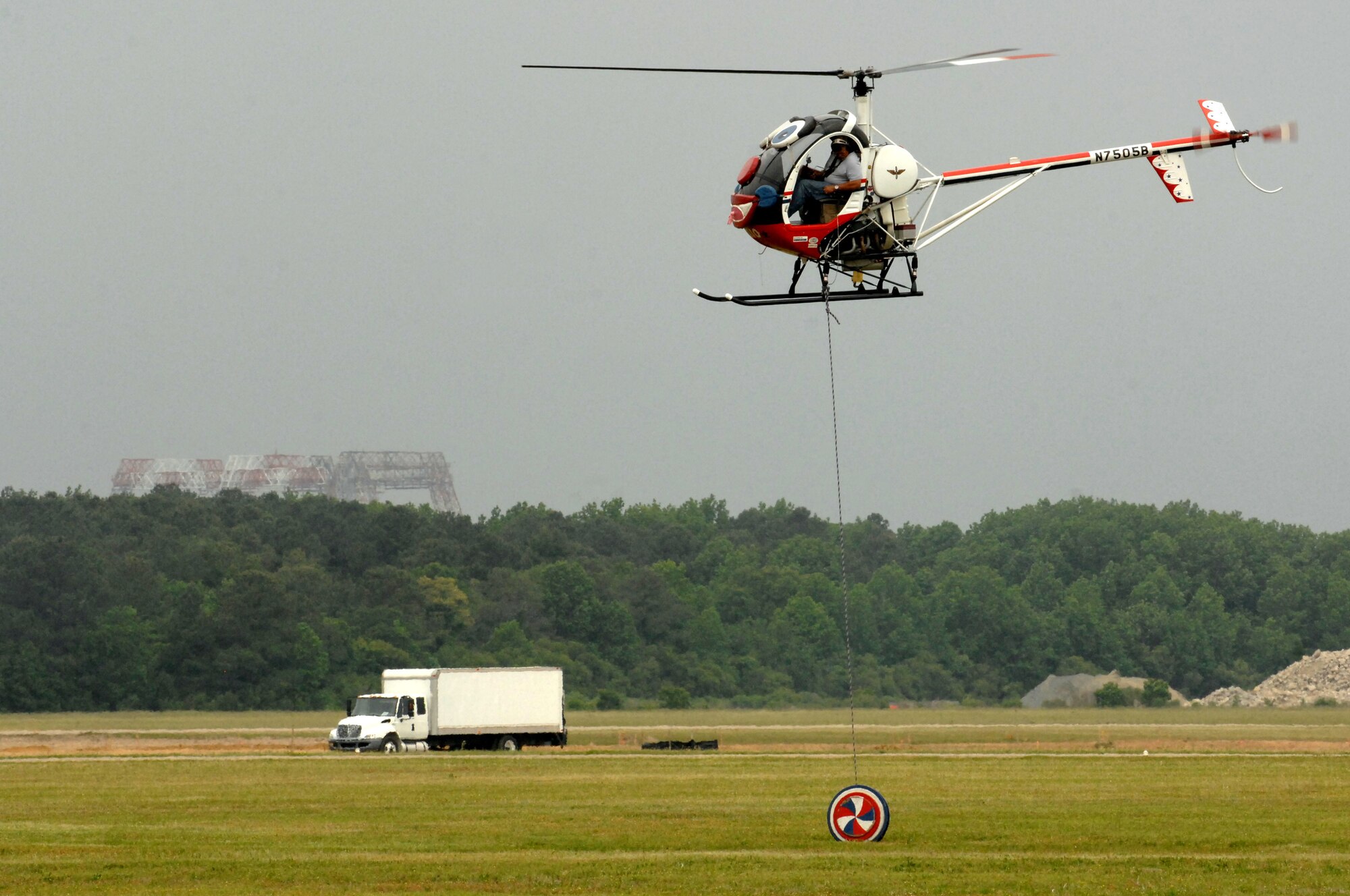 Pilot Roger Buis performs a yo-yo stunt in Otto the Helicopter during the AirPower over Hampton Roads open house at Langley Air Force Base, Va., May 13, 2011. The open house educates the public about Air Force capabilities and shows appreciation to the local community. (U.S. Air Force photo by Staff Sgt. Jeff Nevison)(RELEASED)
