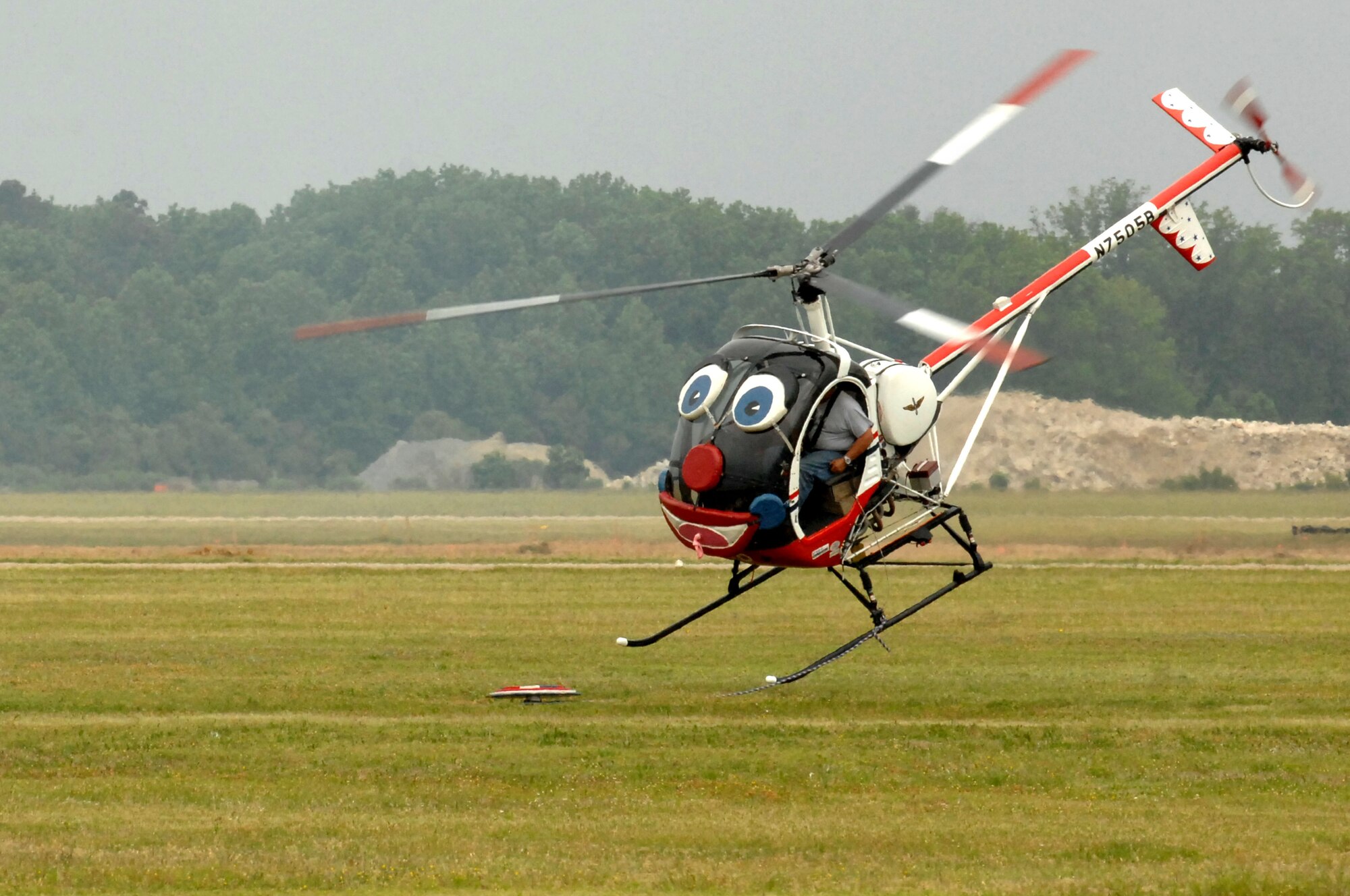 Pilot Roger Buis performs aerobatics in Otto the Helicopter during the AirPower over Hampton Roads open house at Langley Air Force Base, Va., May 13, 2011. The open house educates the public about Air Force capabilities and shows appreciation to the local community. (U.S. Air Force photo by Staff Sgt. Jeff Nevison)(RELEASED)