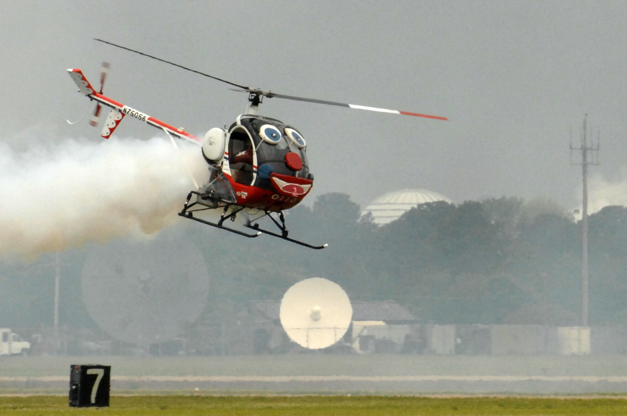 Pilot Roger Buis performs aerobatics in Otto the Helicopter during the AirPower over Hampton Roads open house at Langley Air Force Base, Va., May 13, 2011. The open house educates the public about Air Force capabilities and shows appreciation to the local community. (U.S. Air Force photo by Staff Sgt. Jeff Nevison)(RELEASED)