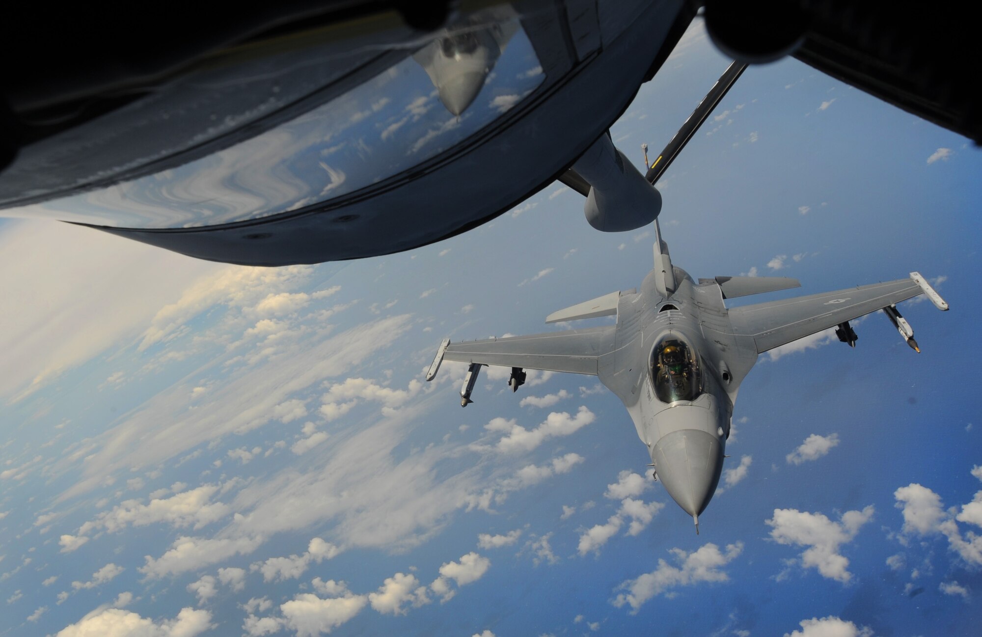 An F-22 pilot prepares to receive fuel from a KC-135 during a routine training mission over the pacific May 12. A group of Junior ROTC students from various high schools in Hawaii participated in the mission with the 96th Air Refueling Squadron and were able to watch the action from the boom of the aircraft. (U.S. Air Force photo/Senior Airman Lauren Main)