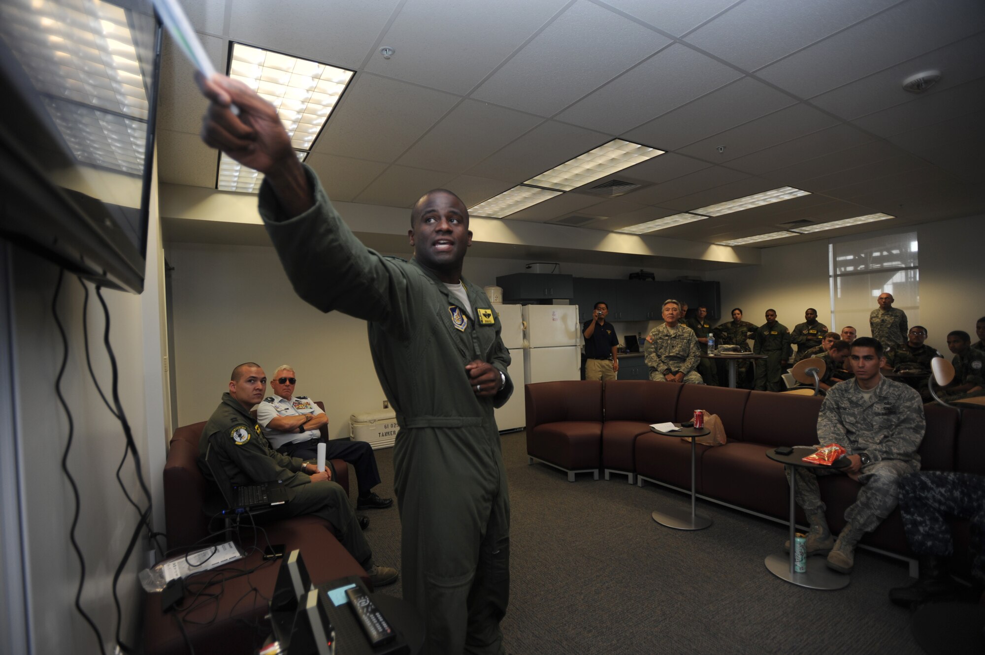 Lt. Col. Brian Hill, 96th Air Refueling Squadron commander, speaks to Junior ROTC students from various high schools around the island May 12. The students received a tour that showcased the career fields that the Air Force has to offer and flew on an aerial refueling training mission over the Hawaiian Islands. (U.S. Air Force photo/Senior Airman Lauren Main)