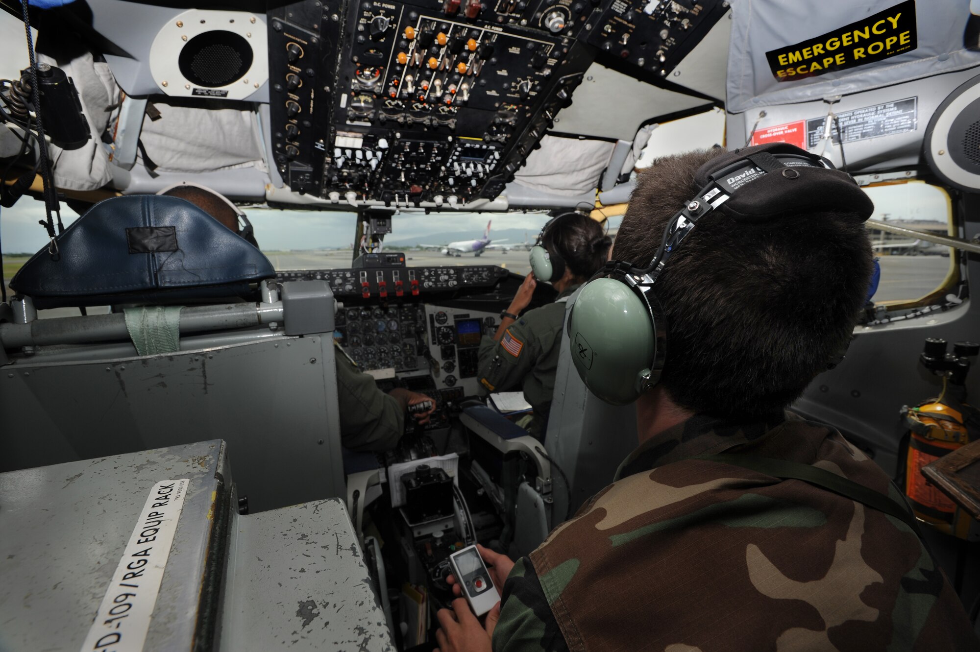 Christian Lambert, a Junior ROTC Kaiser High School student, watches as the KC-135 taxis through the flightline after landing May 12. The flight was a routine aerial refueling training mission that not only transported fuel, but more than 30 high school students with aspirations to join the military. (U.S. Air Force photo/Senior Airman Lauren Main)